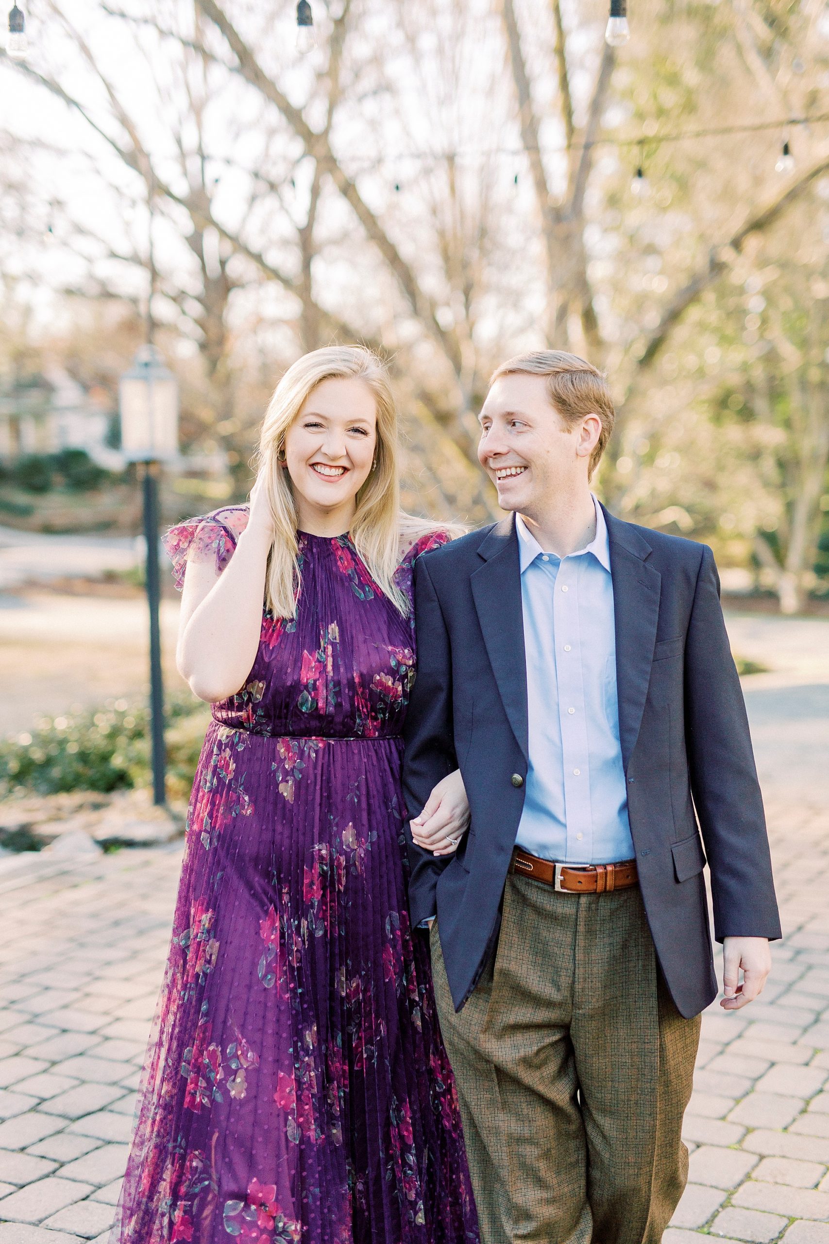 groom looks up at bride during engagement photos at Ritchie Hill