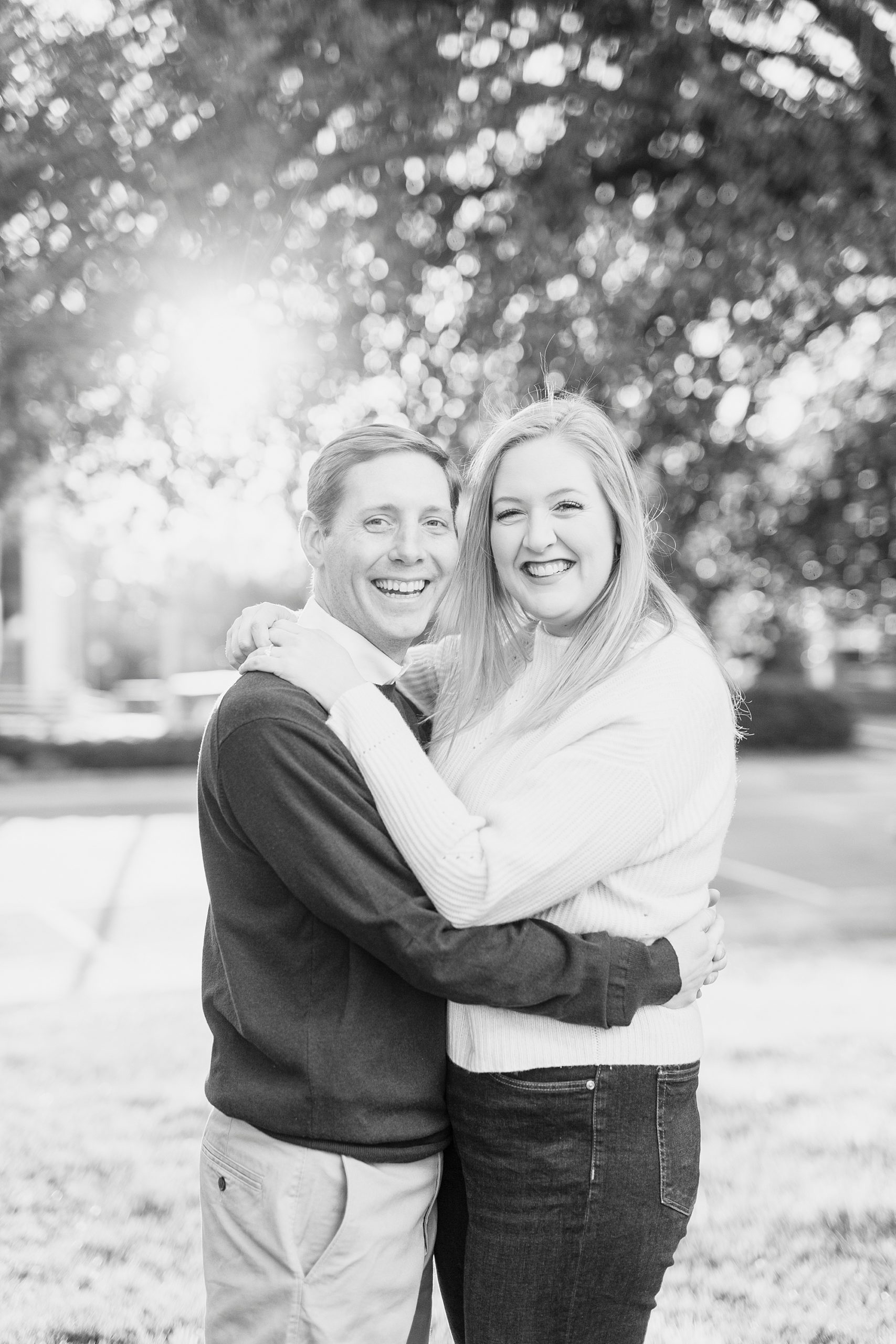 bride and groom smile together at sunset in Downtown Concord