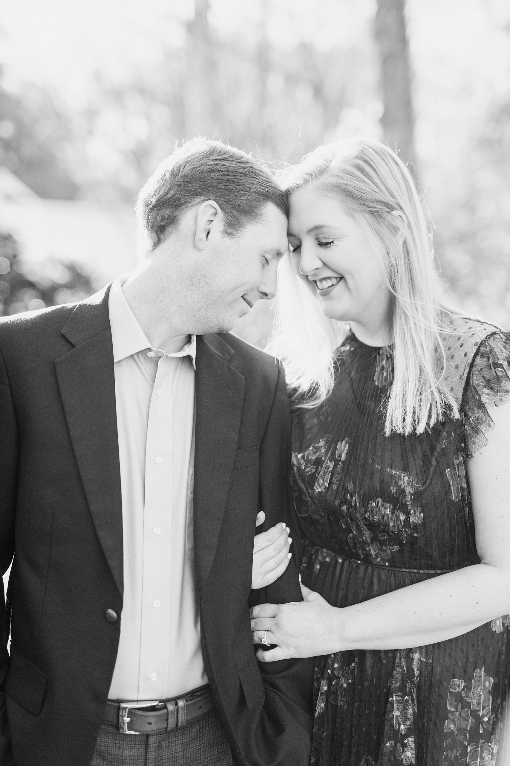 engaged couple leans heads together during Ritchie Hill engagement photos