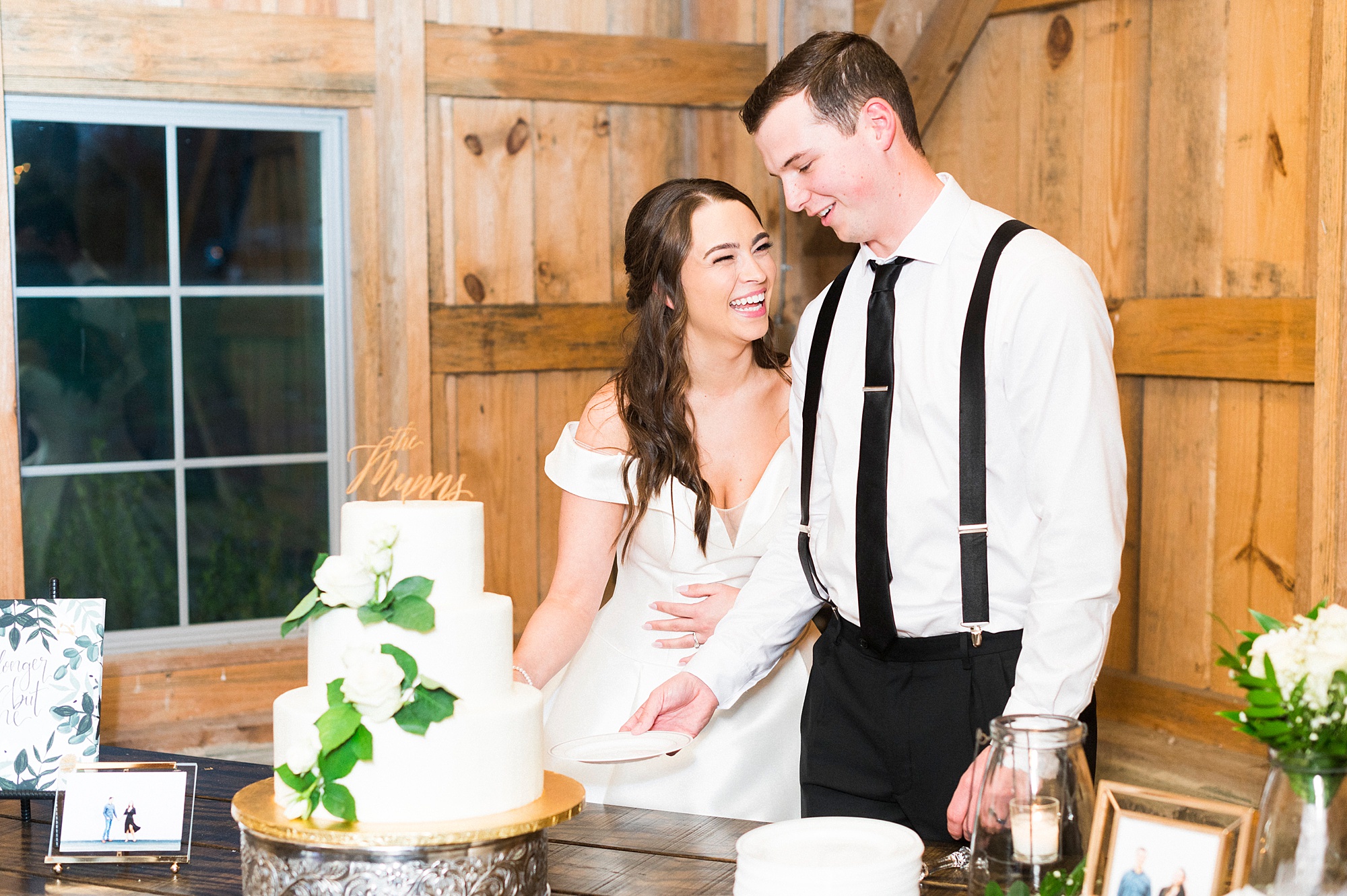 bride and groom cut wedding cake during NC reception