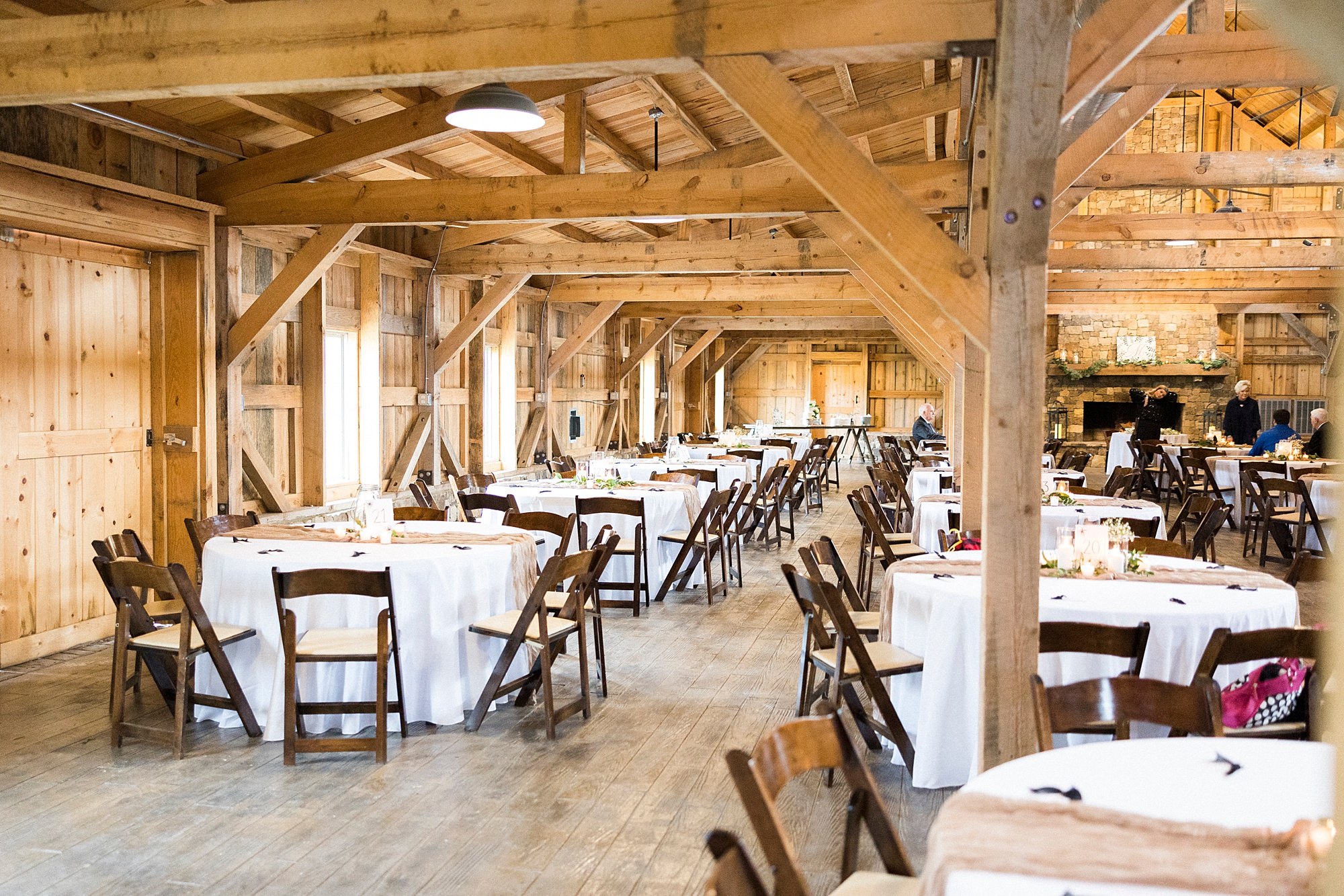 seating for wedding reception in barn at The Farm at Brusharbor