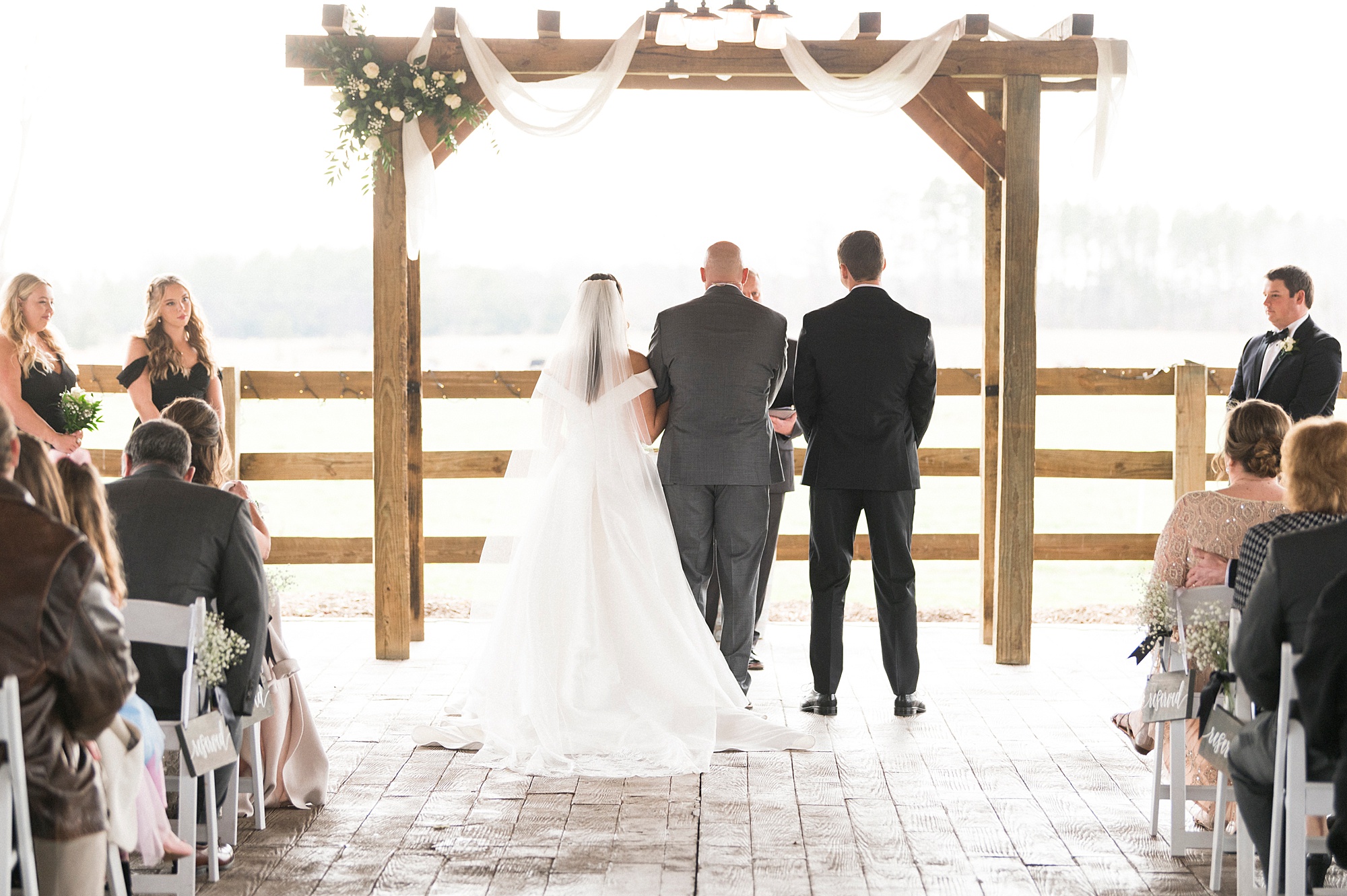dad walks bride to groom at Christ-centered ceremony at The Farm at Brusharbor