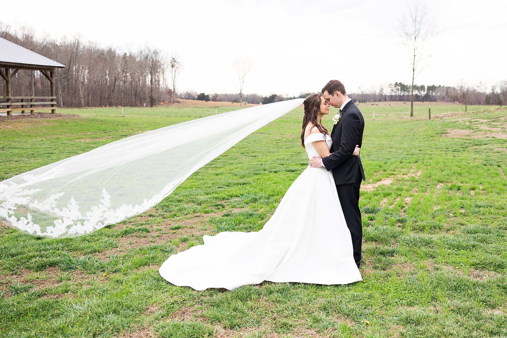 bride and groom lean heads together with foreheads touching