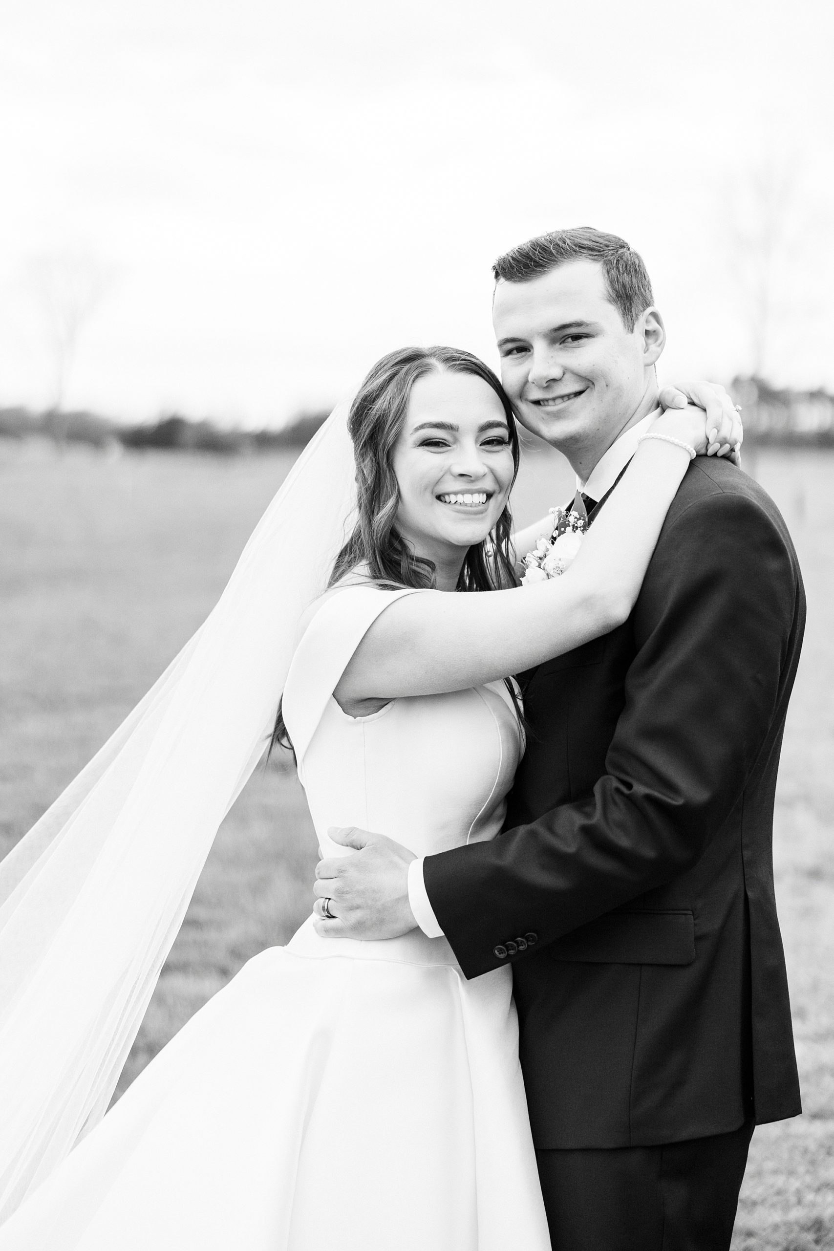 bride hugs groom during The Farm at Brusharbor wedding portraits