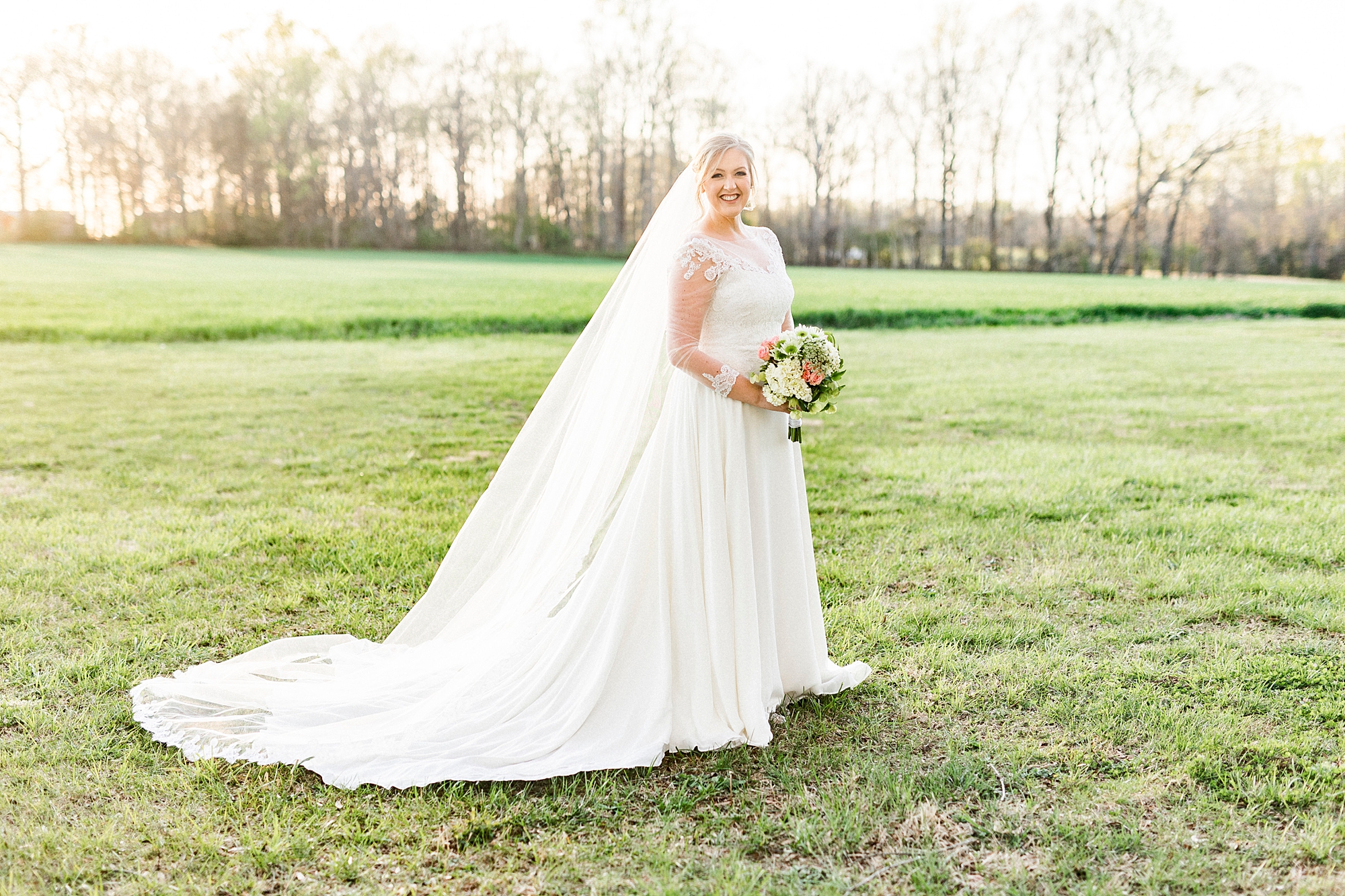 bride walks through field during Mooresville bridal portraits