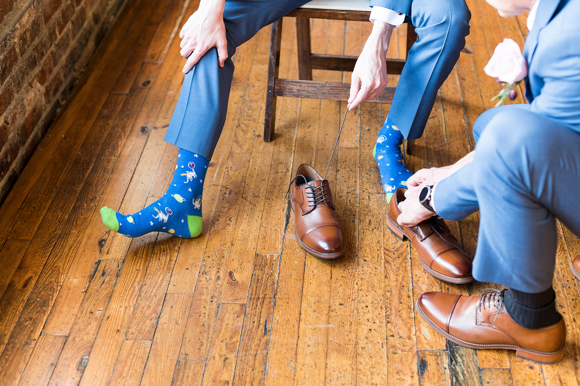groom prepares for wedding day with fun custom socks
