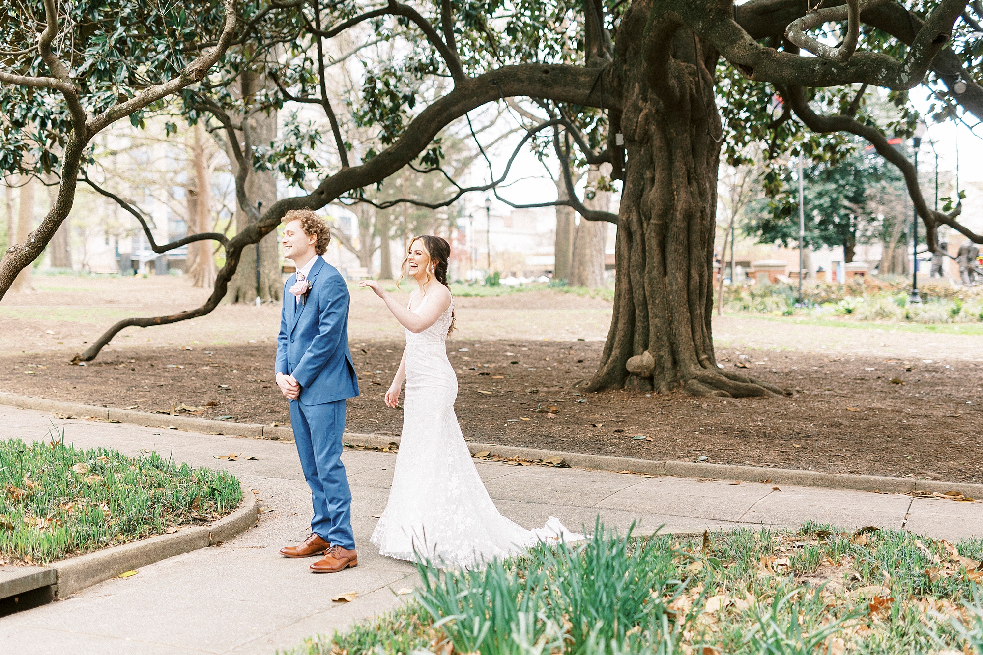 bride and groom meet for first look in courtyard at Stockroom at 230