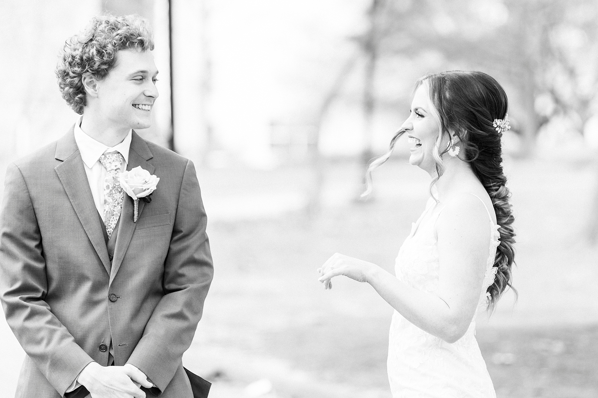 bride and groom smile during first look at Stockroom at 230