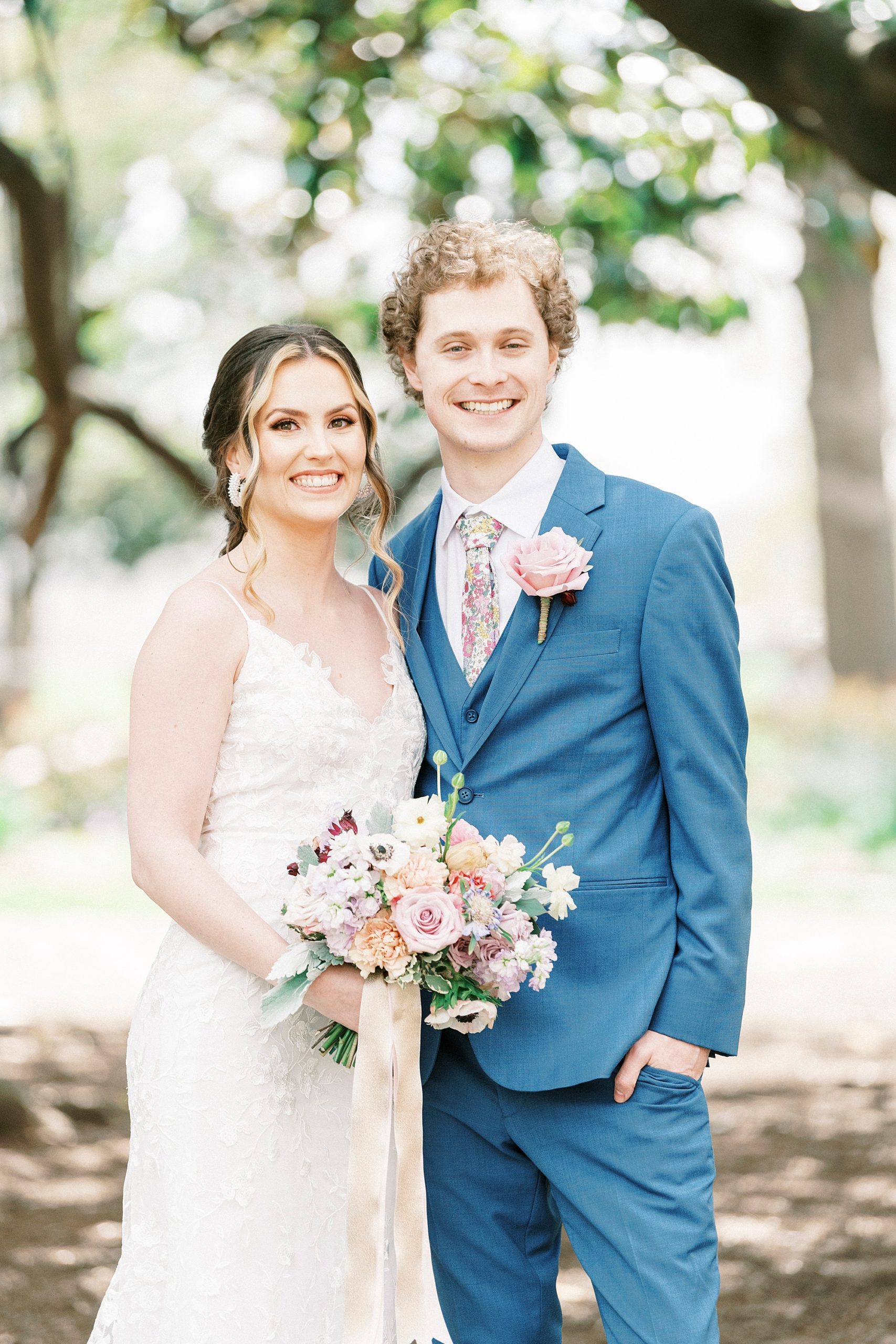 bride and groom hug together in Raleigh NC