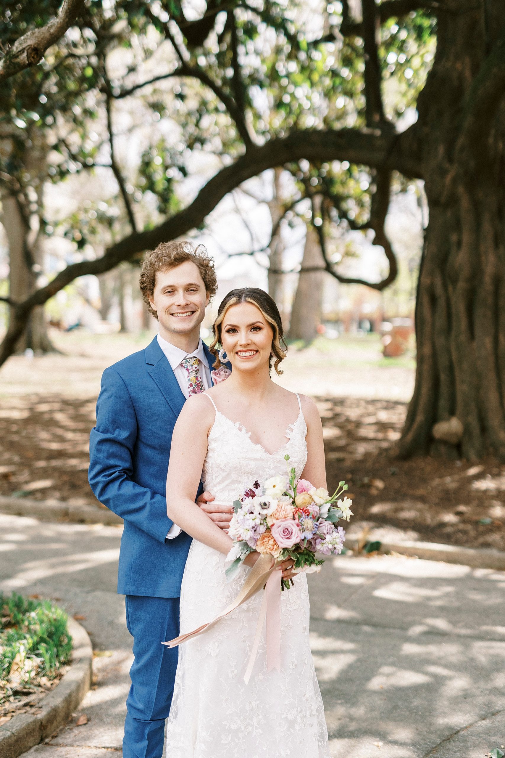 couple hugs during portraits outside of Stockroom at 230
