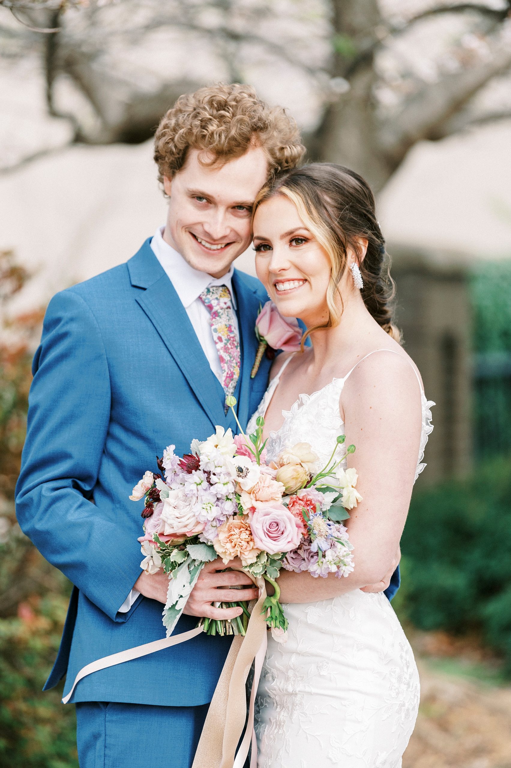 bride and groom hug during spring wedding day at Stockroom at 230