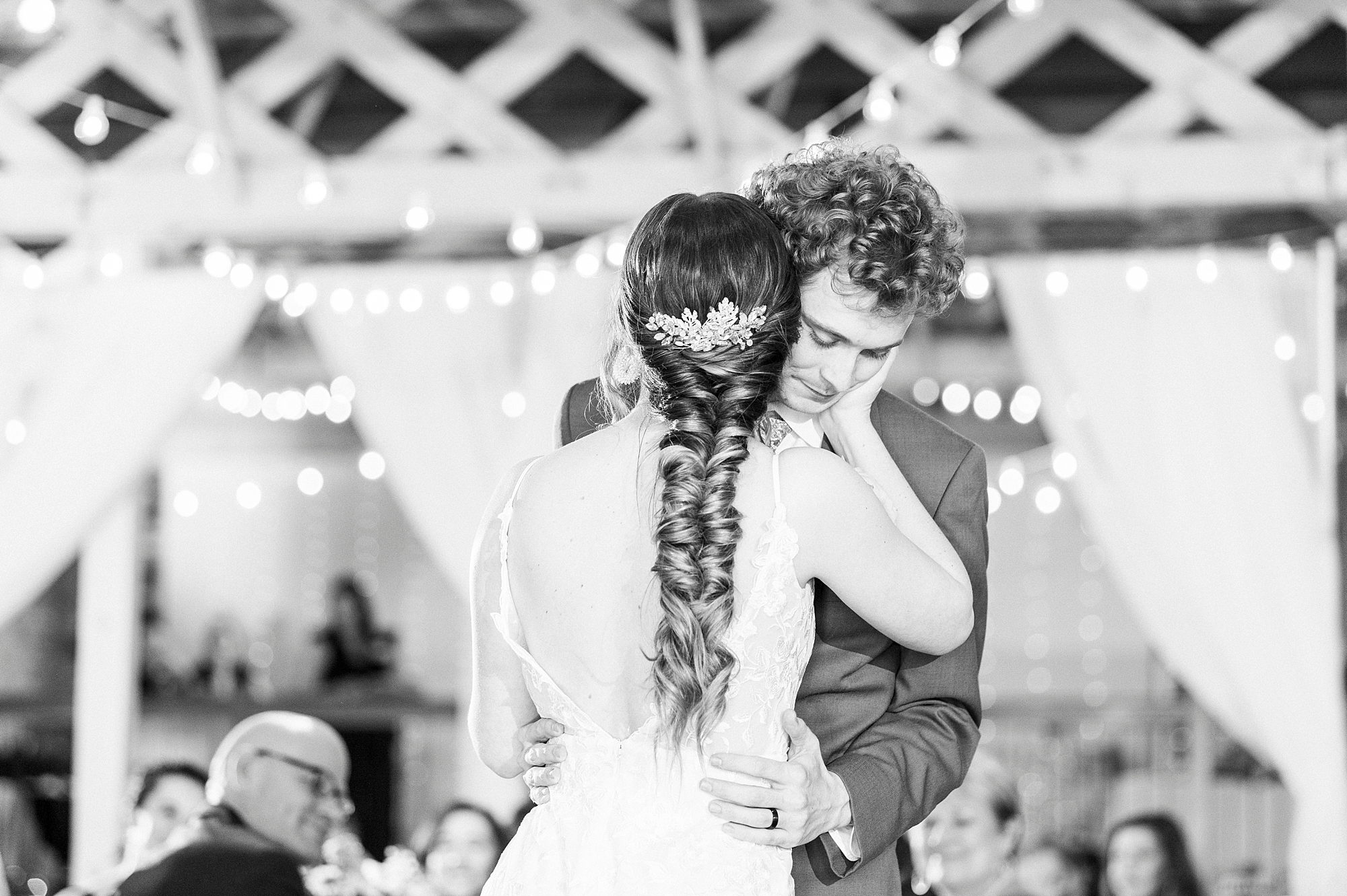 bride and groom have emotional first dance during Raleigh NC wedding reception