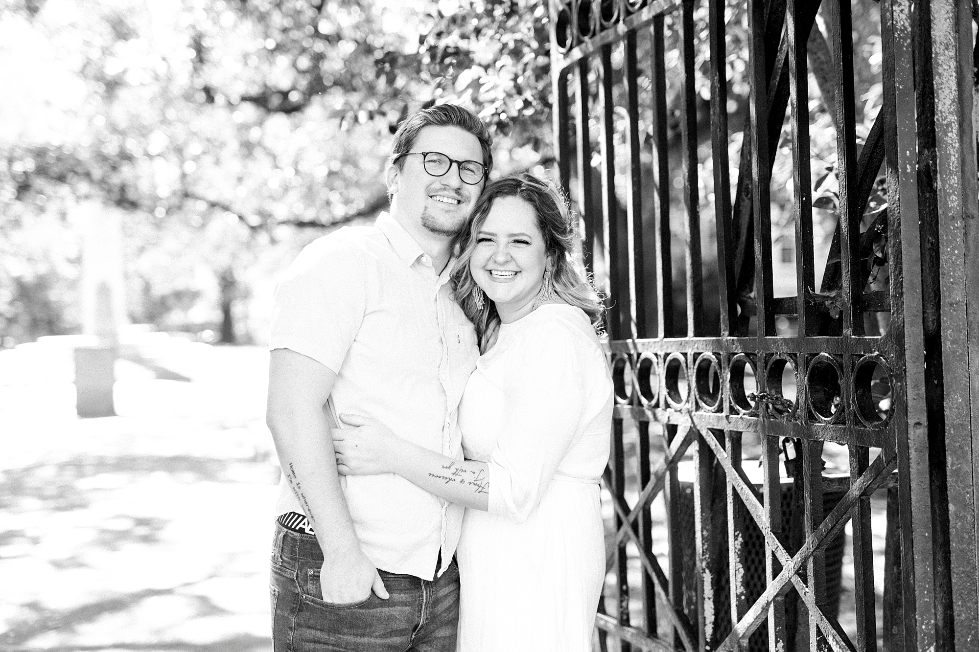 woman hugs husband during downtown Charleston anniversary photos