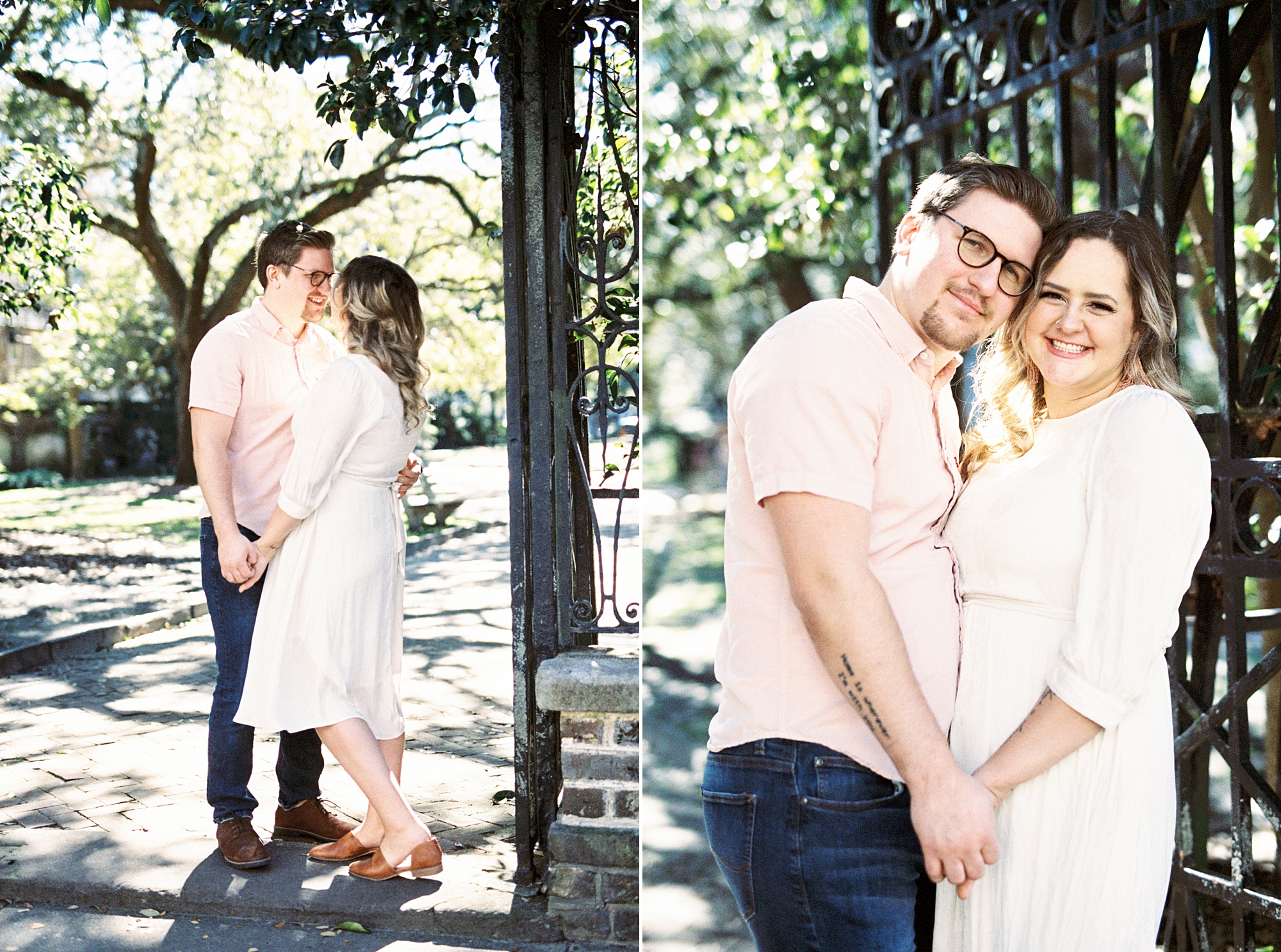 bride and groom stand together holding hands by wrought iron gate