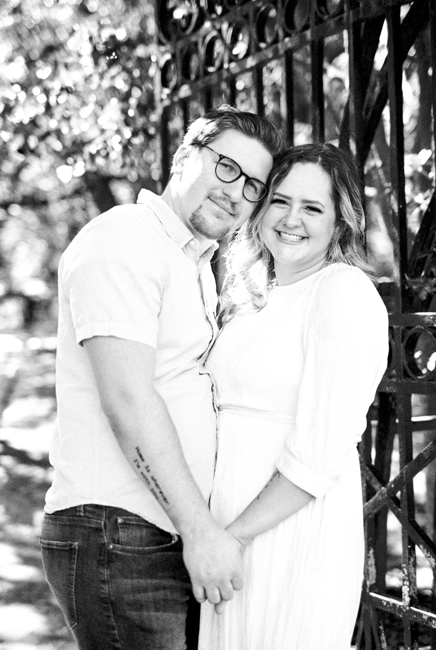married couple holds hands during downtown Charleston anniversary portraits