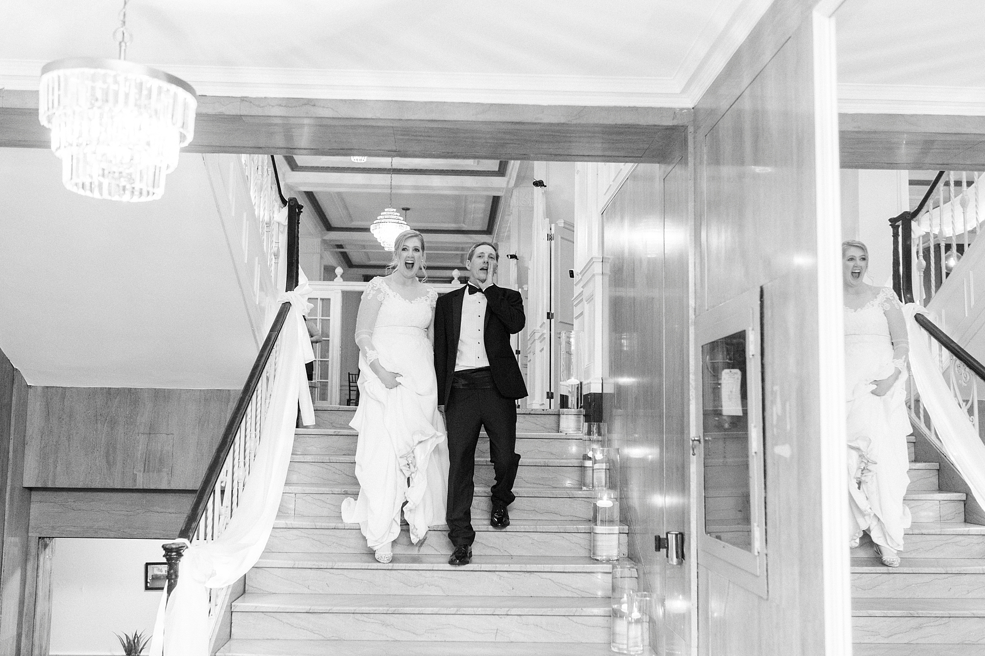 couple gasps walking down steps 
