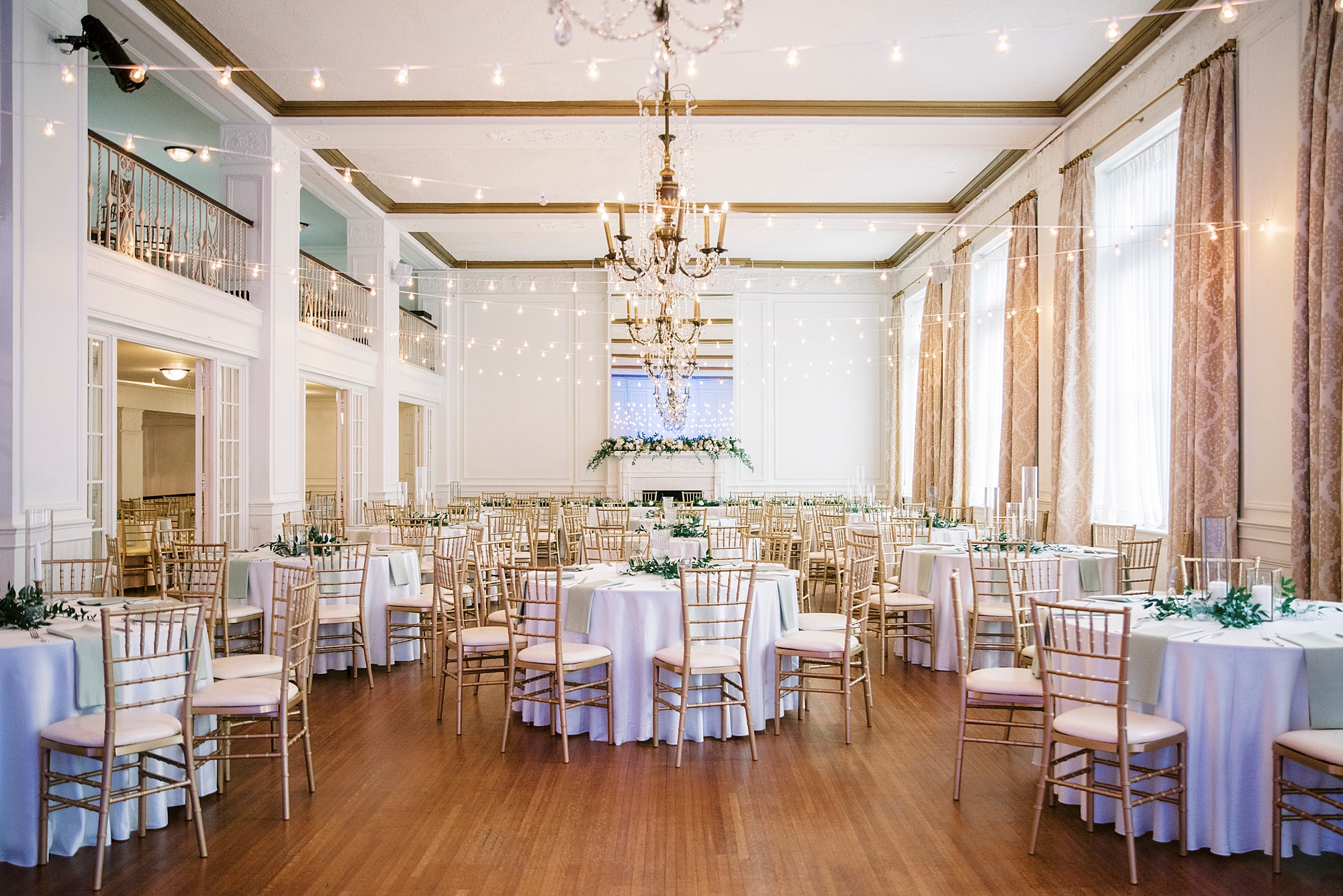 reception space with gold chivari chairs at the Hotel Concord