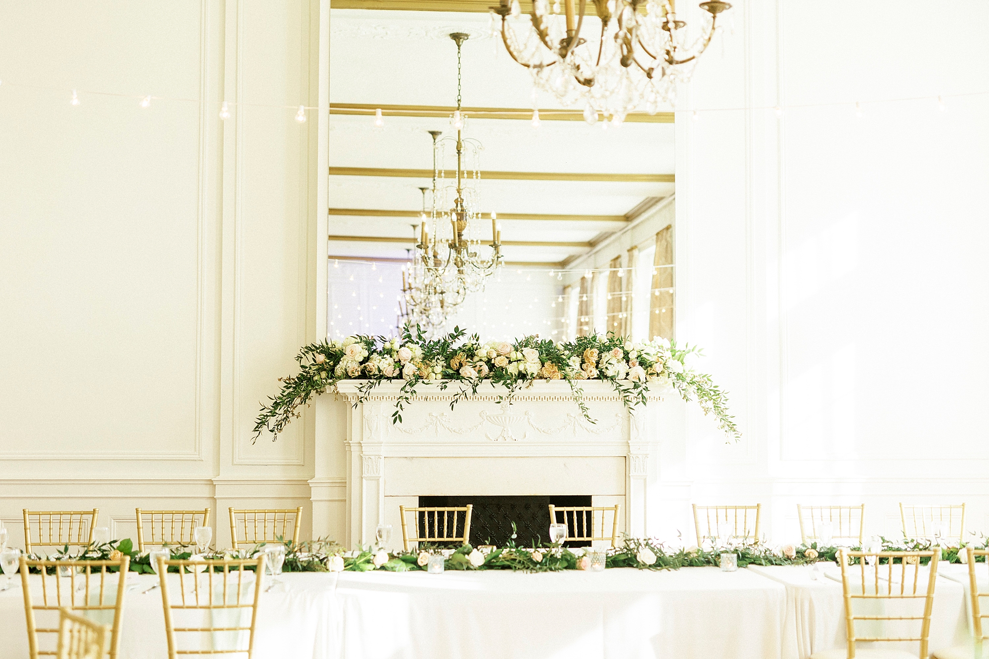 head table with greenery table runner at Hotel Concord wedding reception 