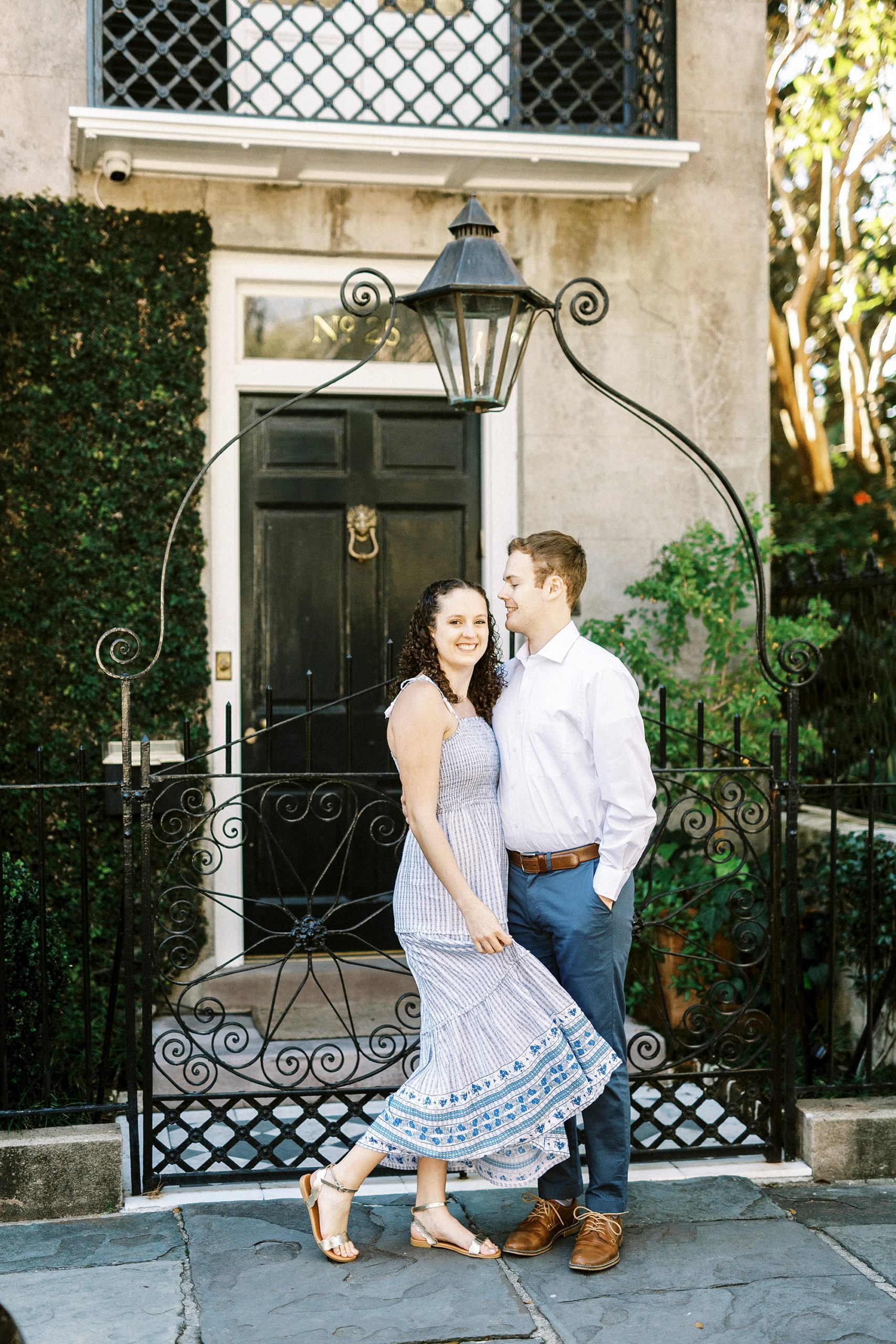 couple stand on street in downtown Charleston 