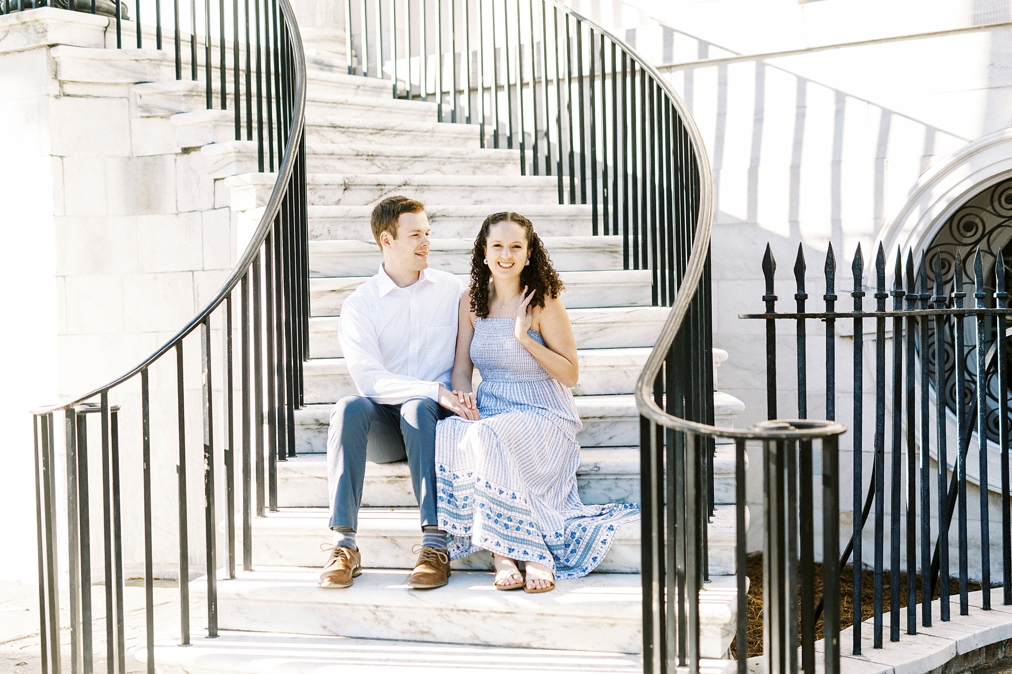 anniversary portraits on steps in Downtown Charleston 