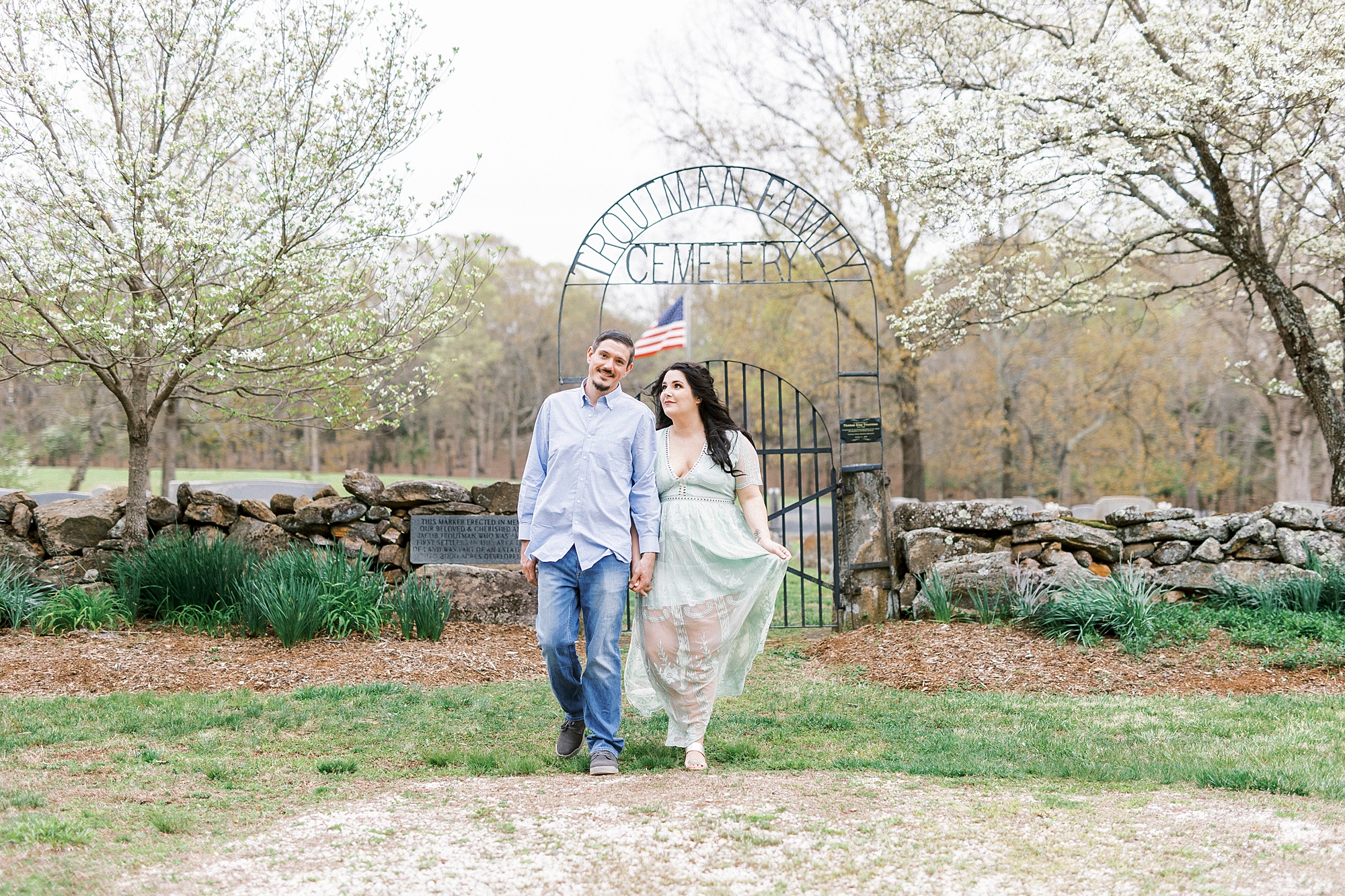 bride and groom walk in gardens of Troutman NC chapel
