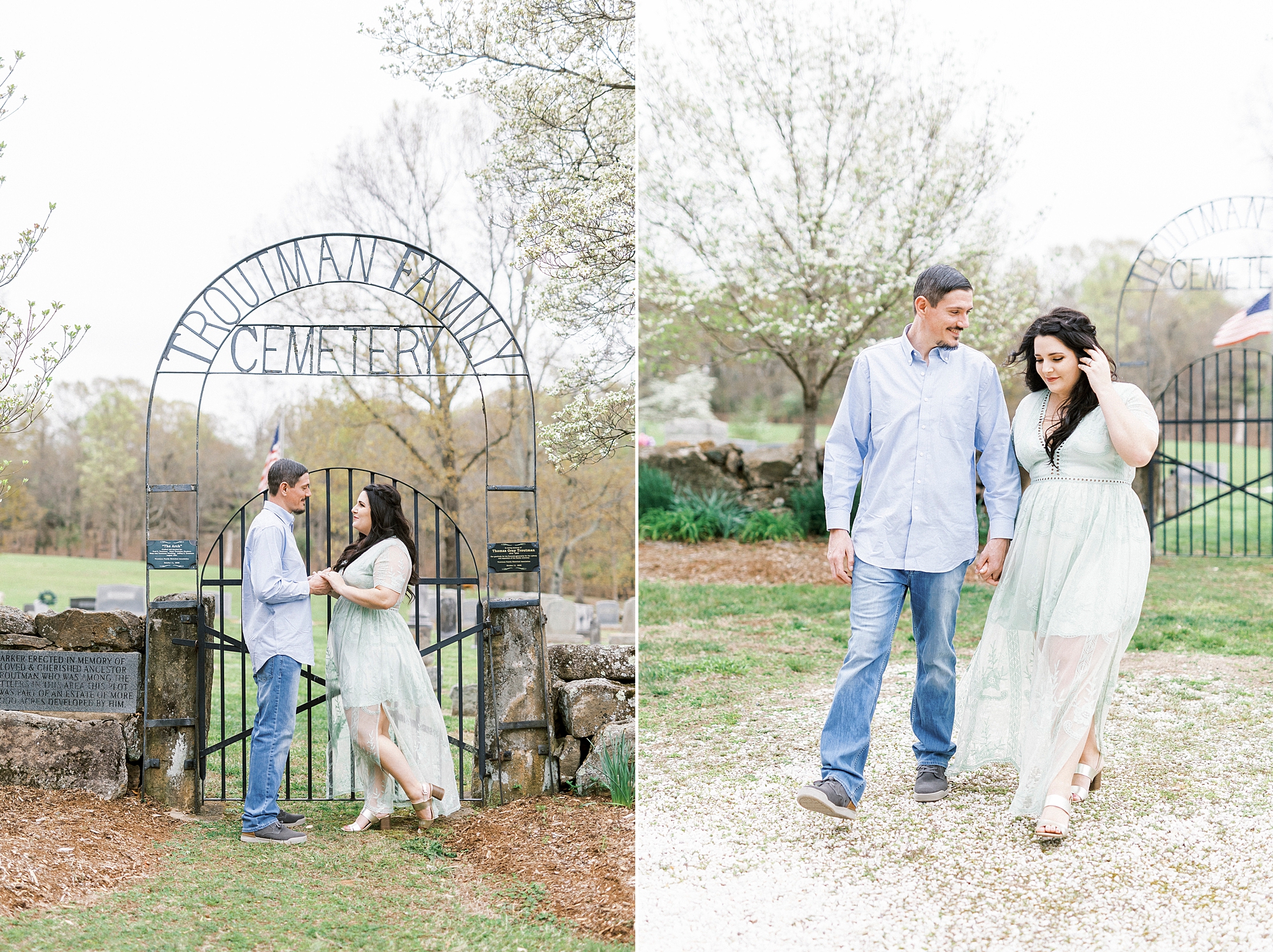 engaged couple stands by wrought iron gate