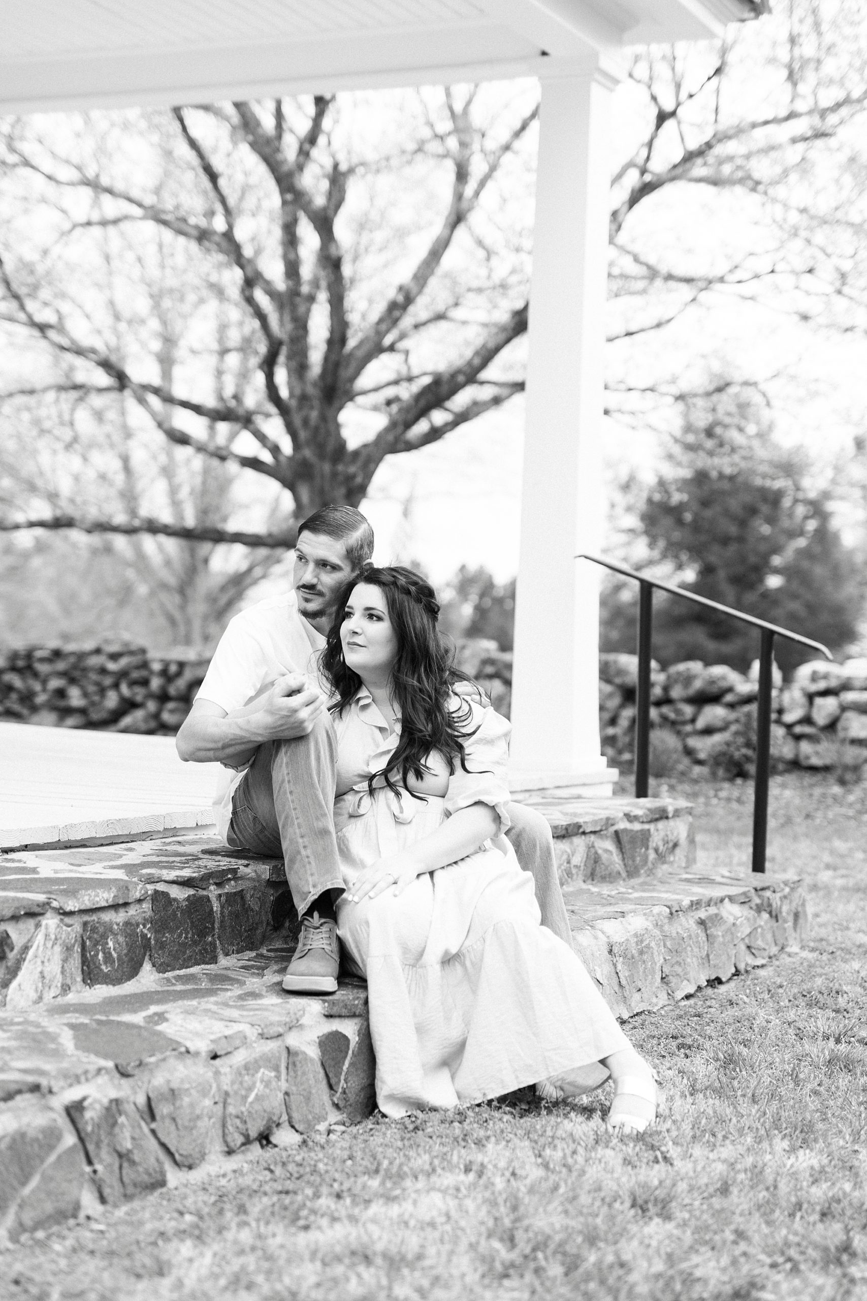 bride and groom sit together on stone staircase 