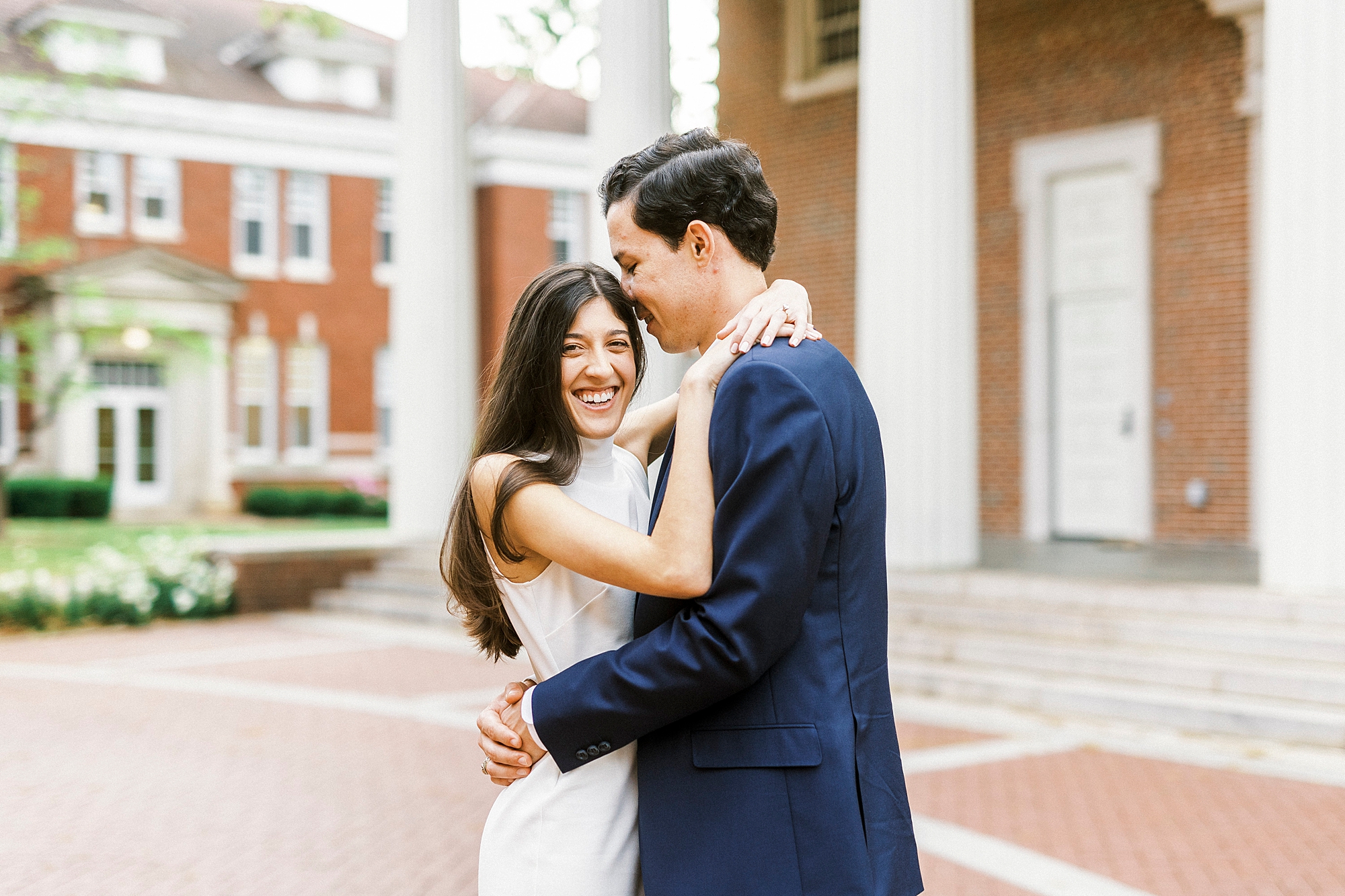 groom makes bride laugh during Charlotte photos