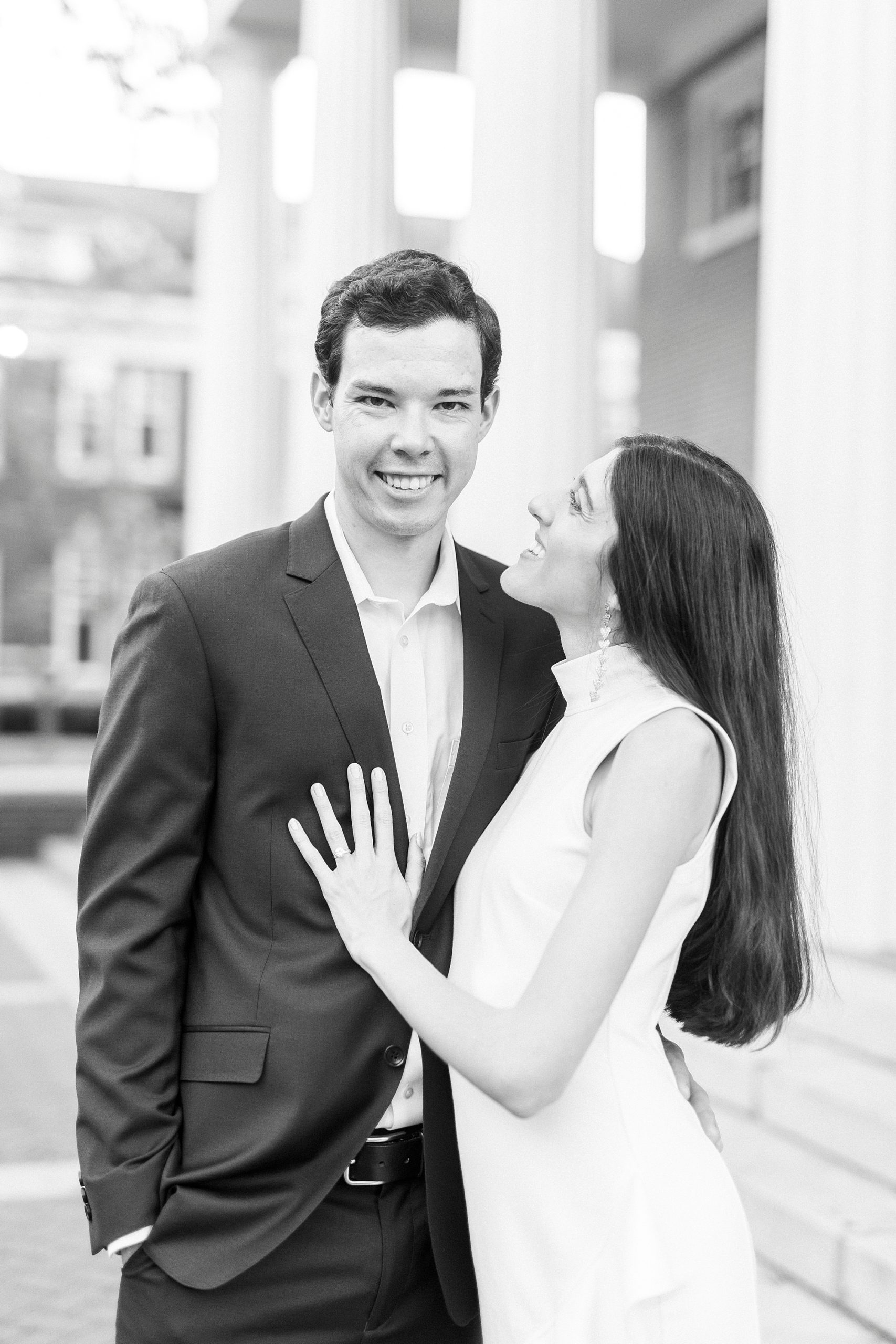bride looks up at groom during Charlotte engagement photos
