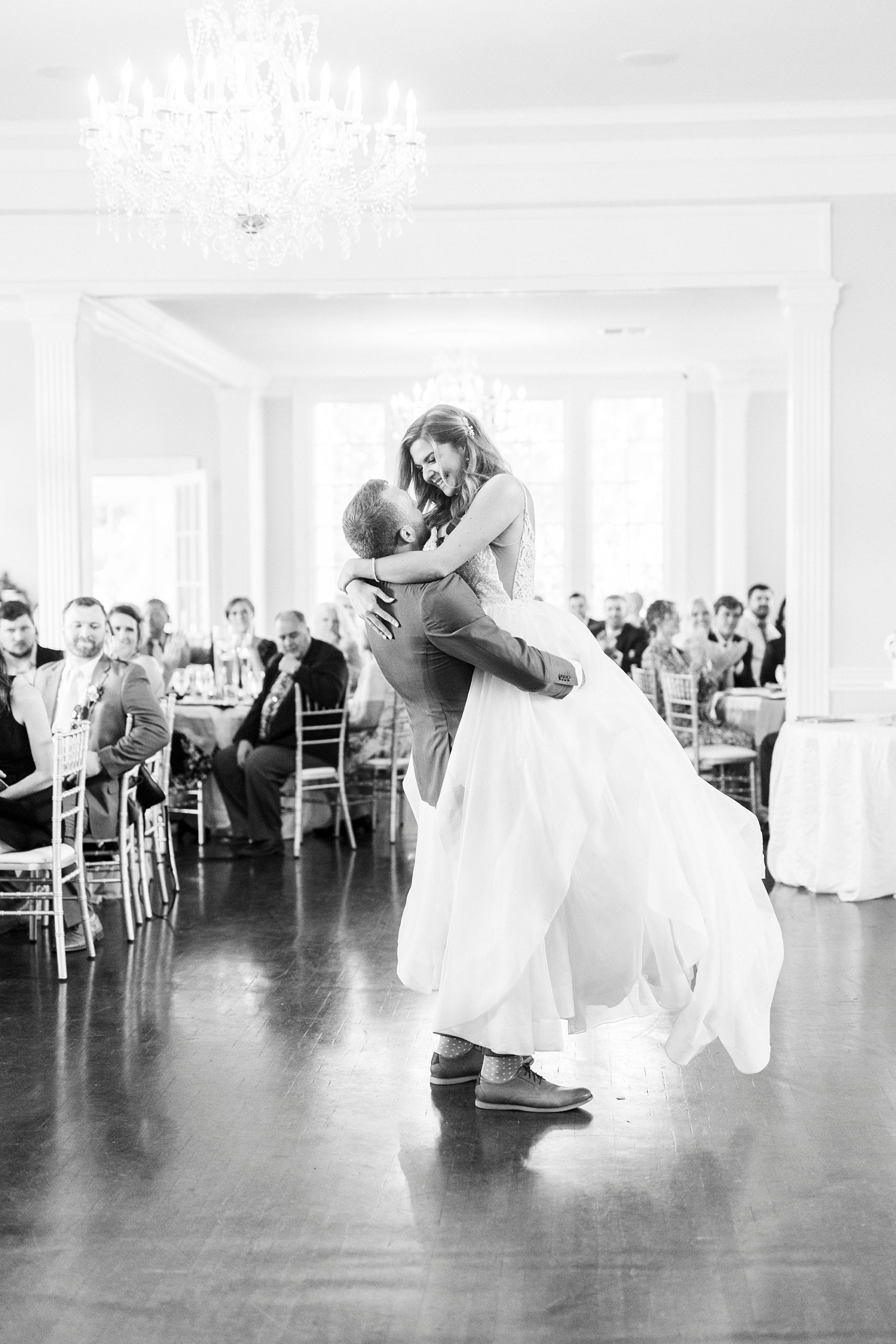 groom lifts bride during Separk Mansion wedding reception 