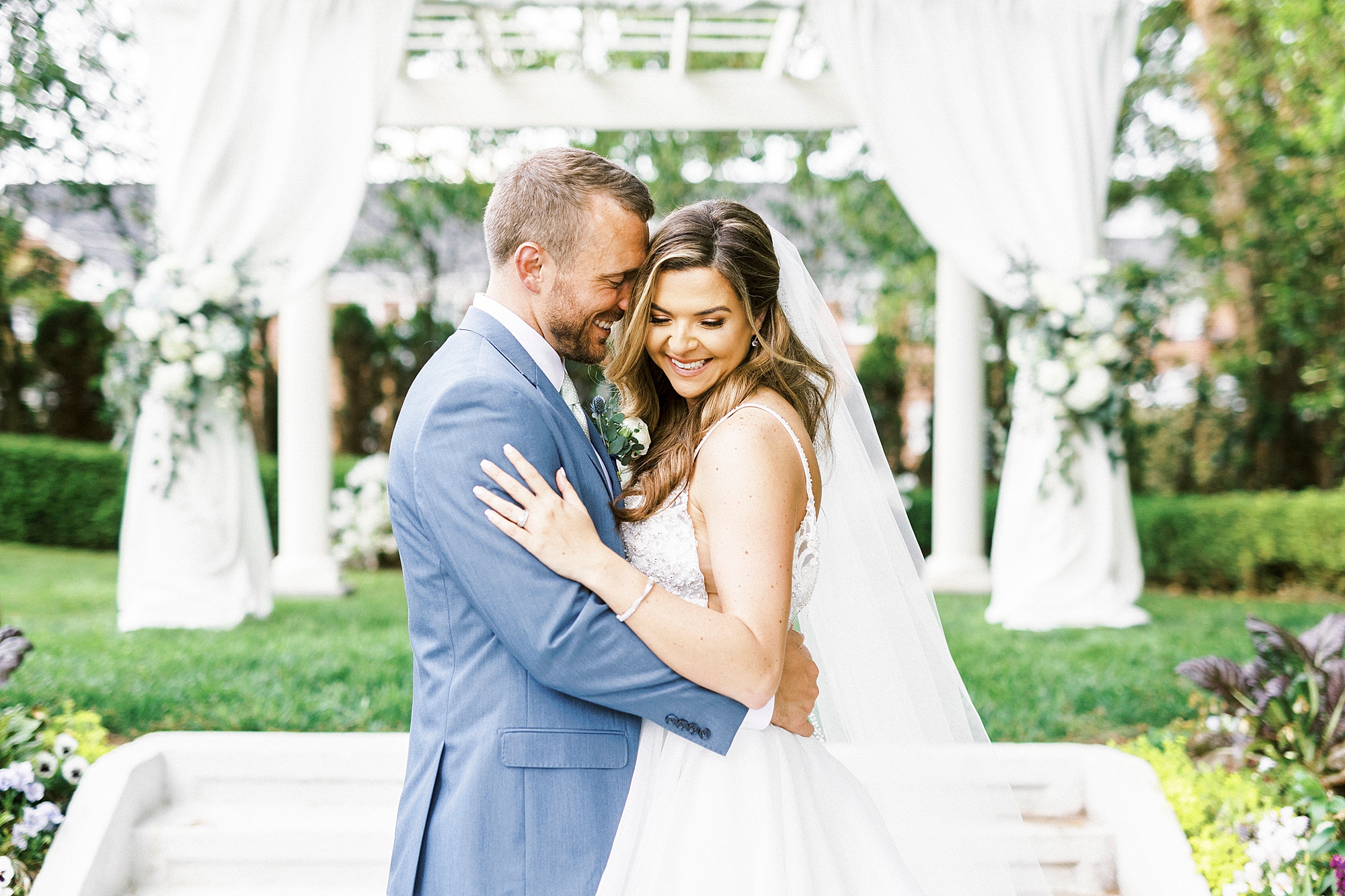 groom nuzzles bride's cheek during portraits in Gastonia NC
