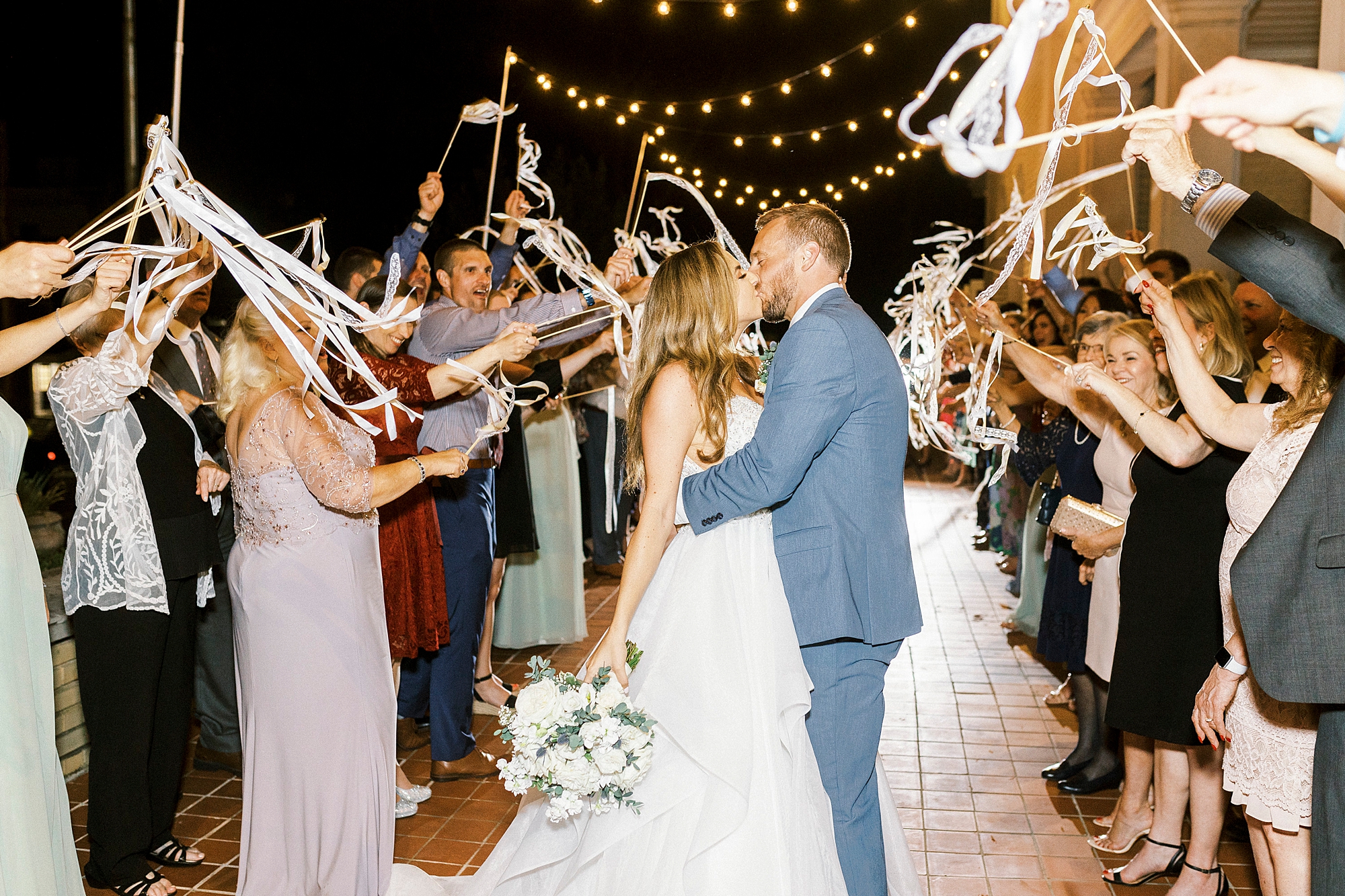 bride and groom kiss during sparkler exit outside Separk Mansion