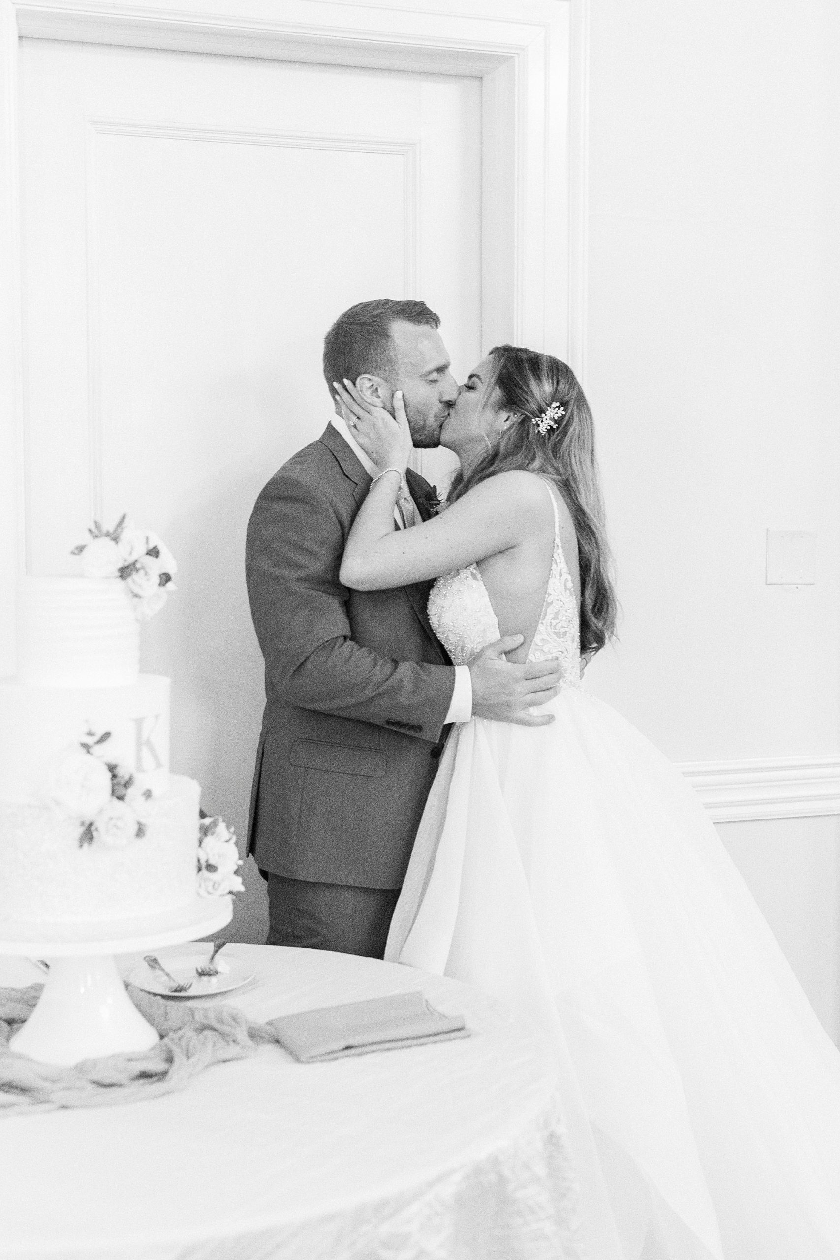 bride and groom cut wedding cake during Gastonia wedding reception