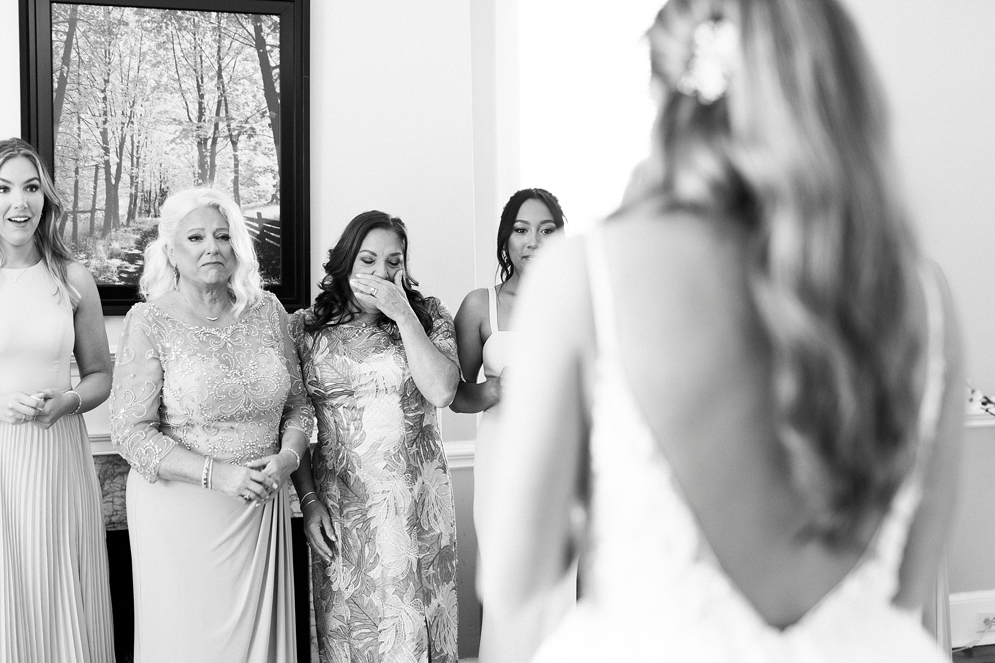 mother cries seeing bride in wedding gown