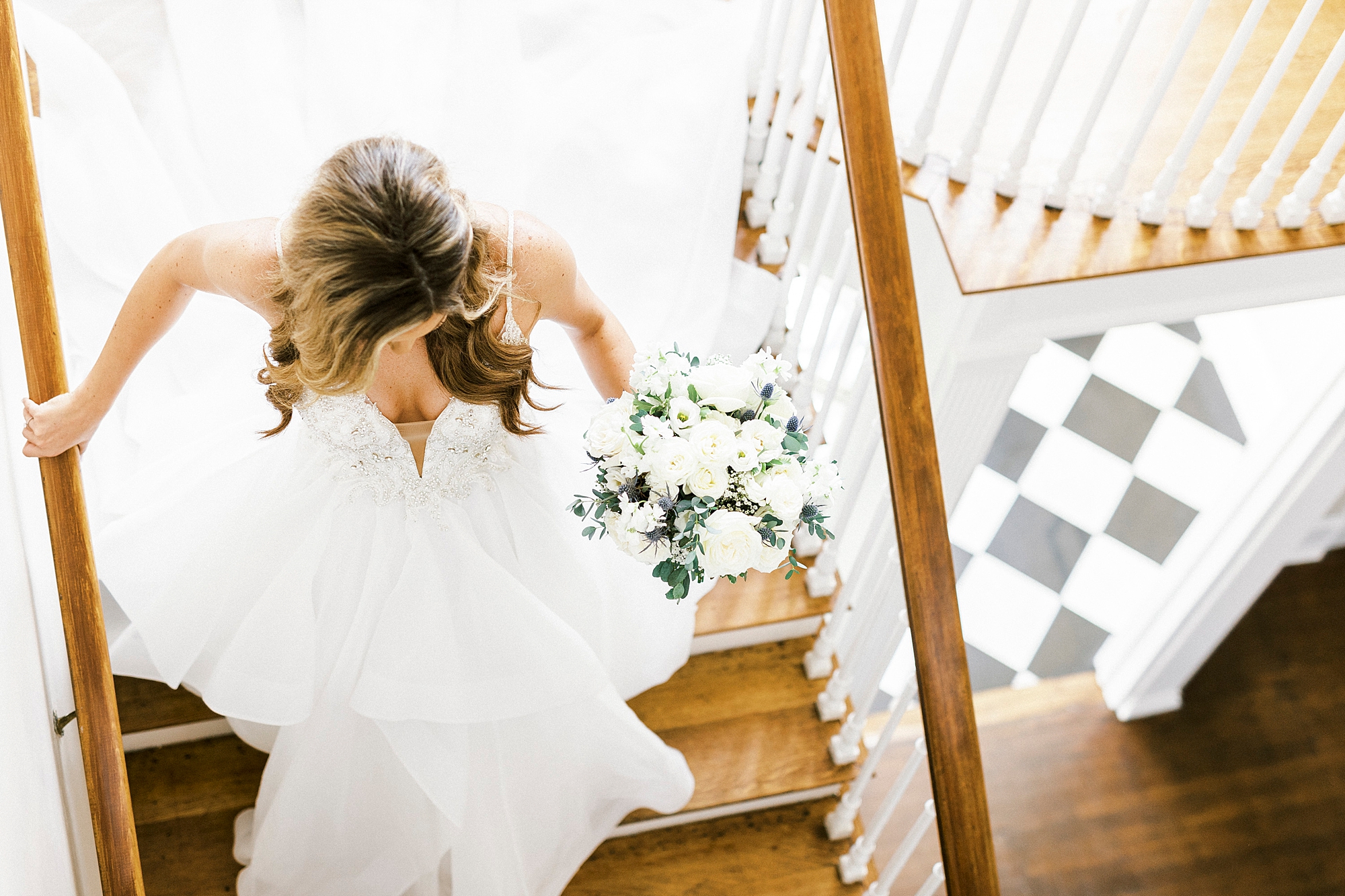 bride walks down staircase in Separk Mansion