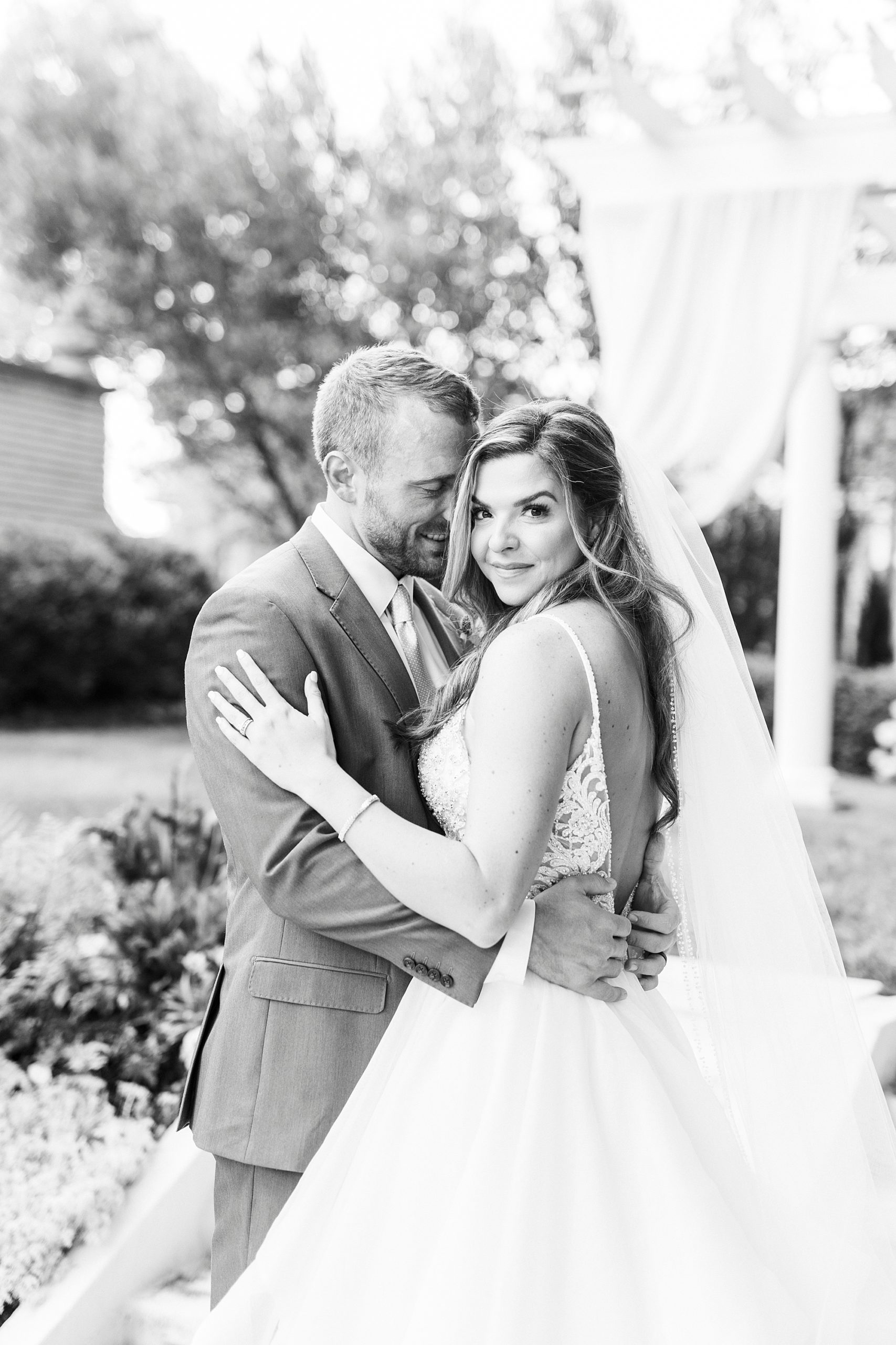 bride and groom hug in gardens at Separk Mansion