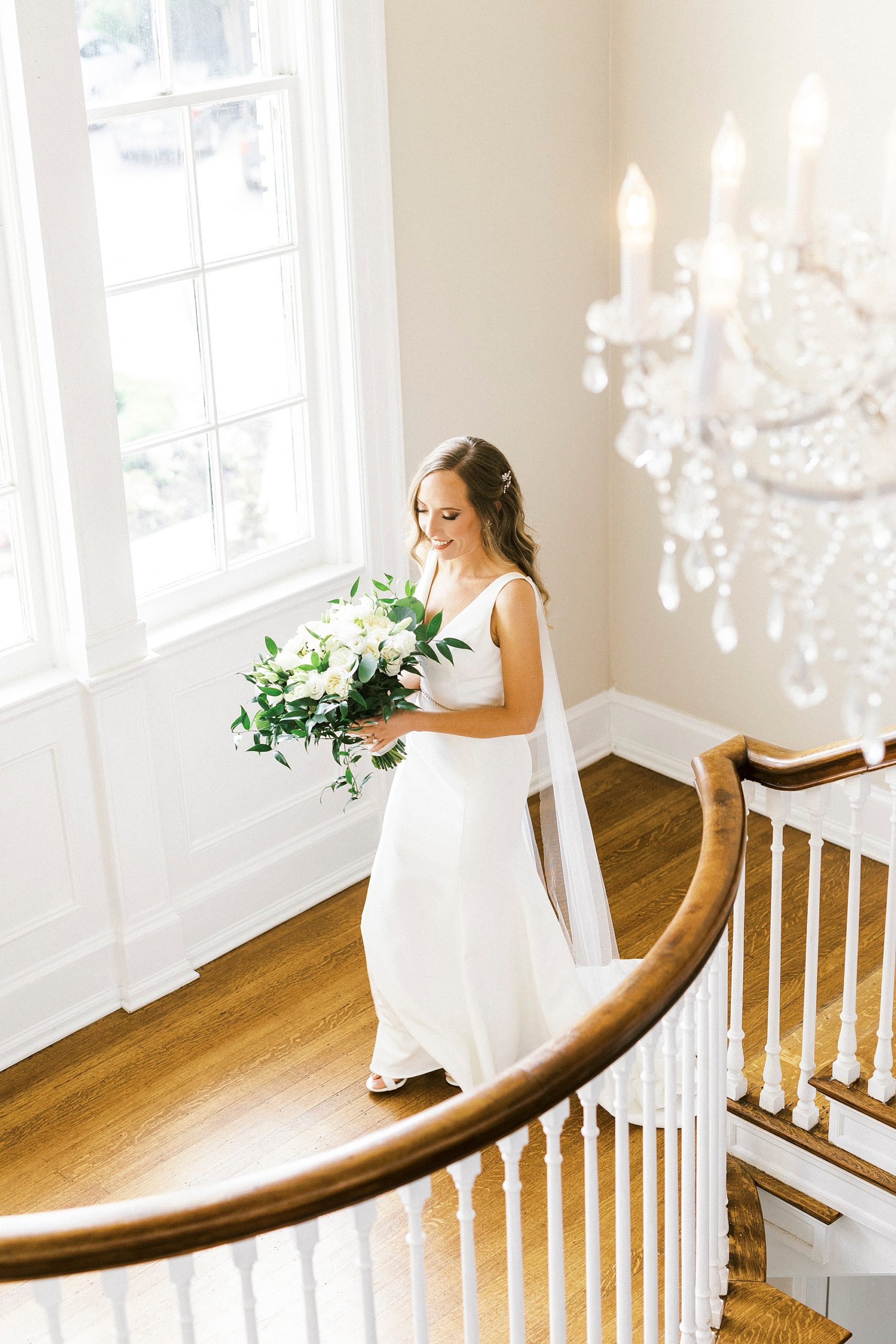 bride walks down staircase at Separk Mansion