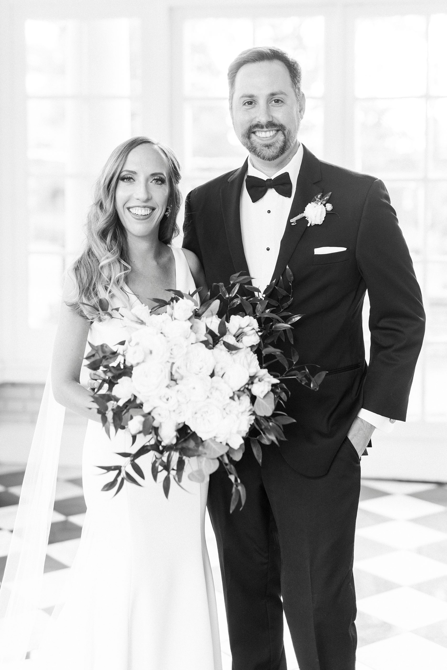 newlyweds stand together in sunroom in Gastonia NC