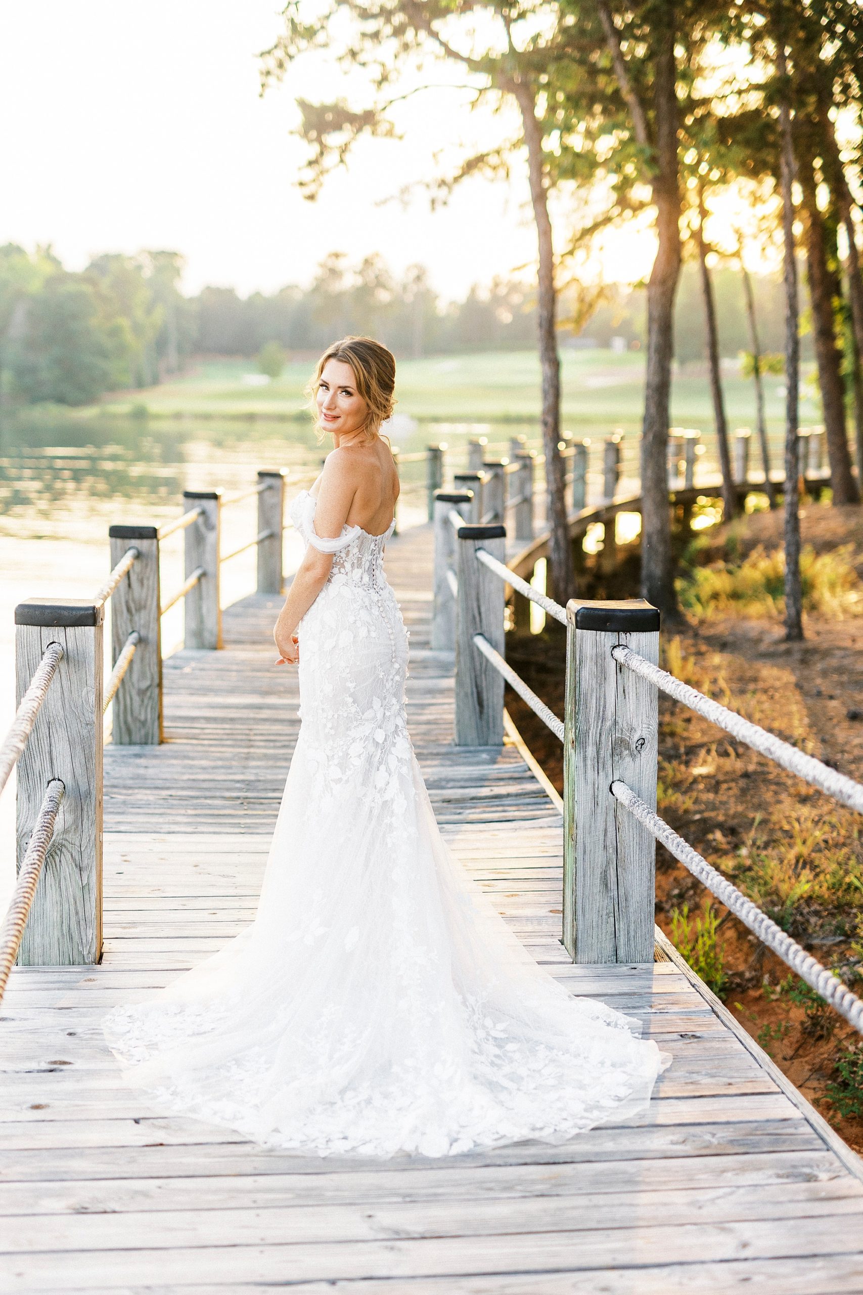 bride looks over her shoulder during Trump National Golf Club bridal session