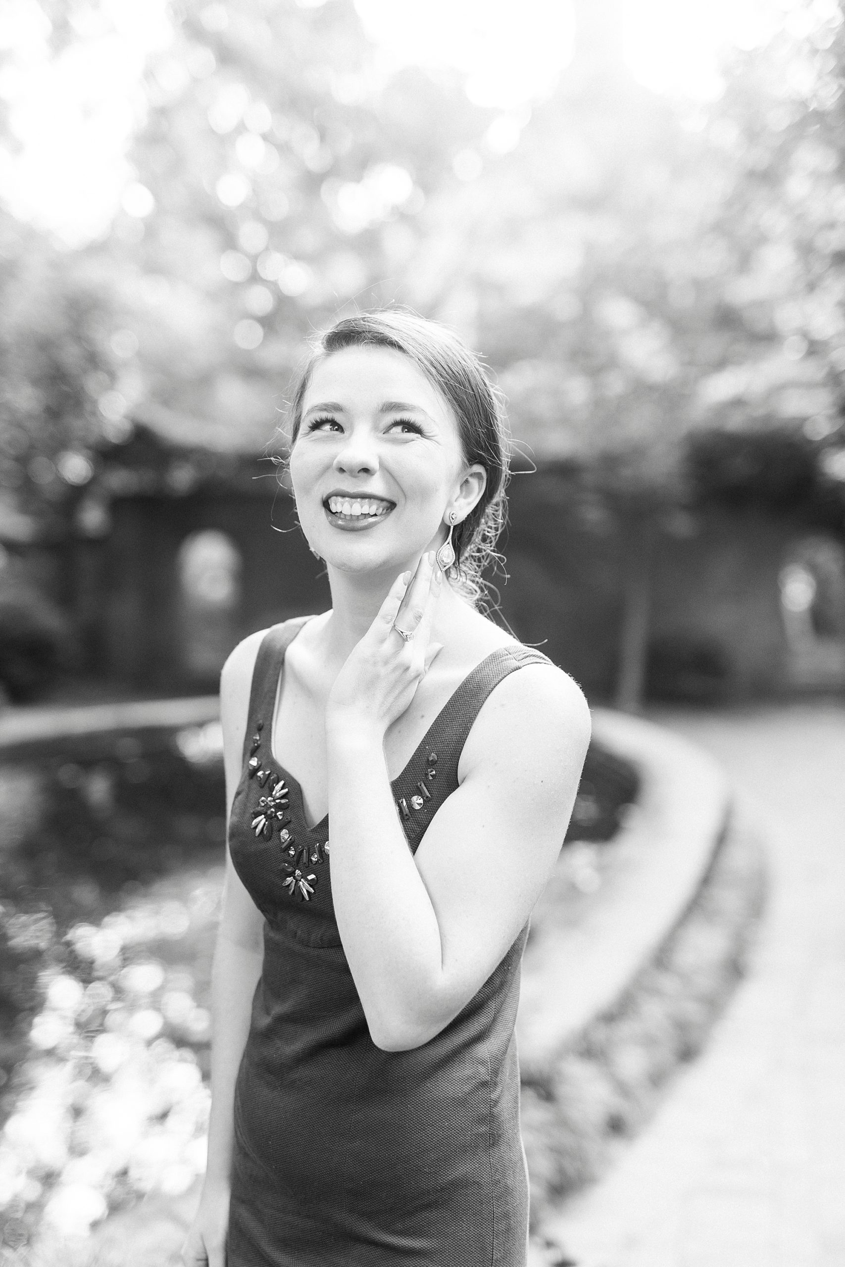 woman stands showing off dress at Wing Haven Garden