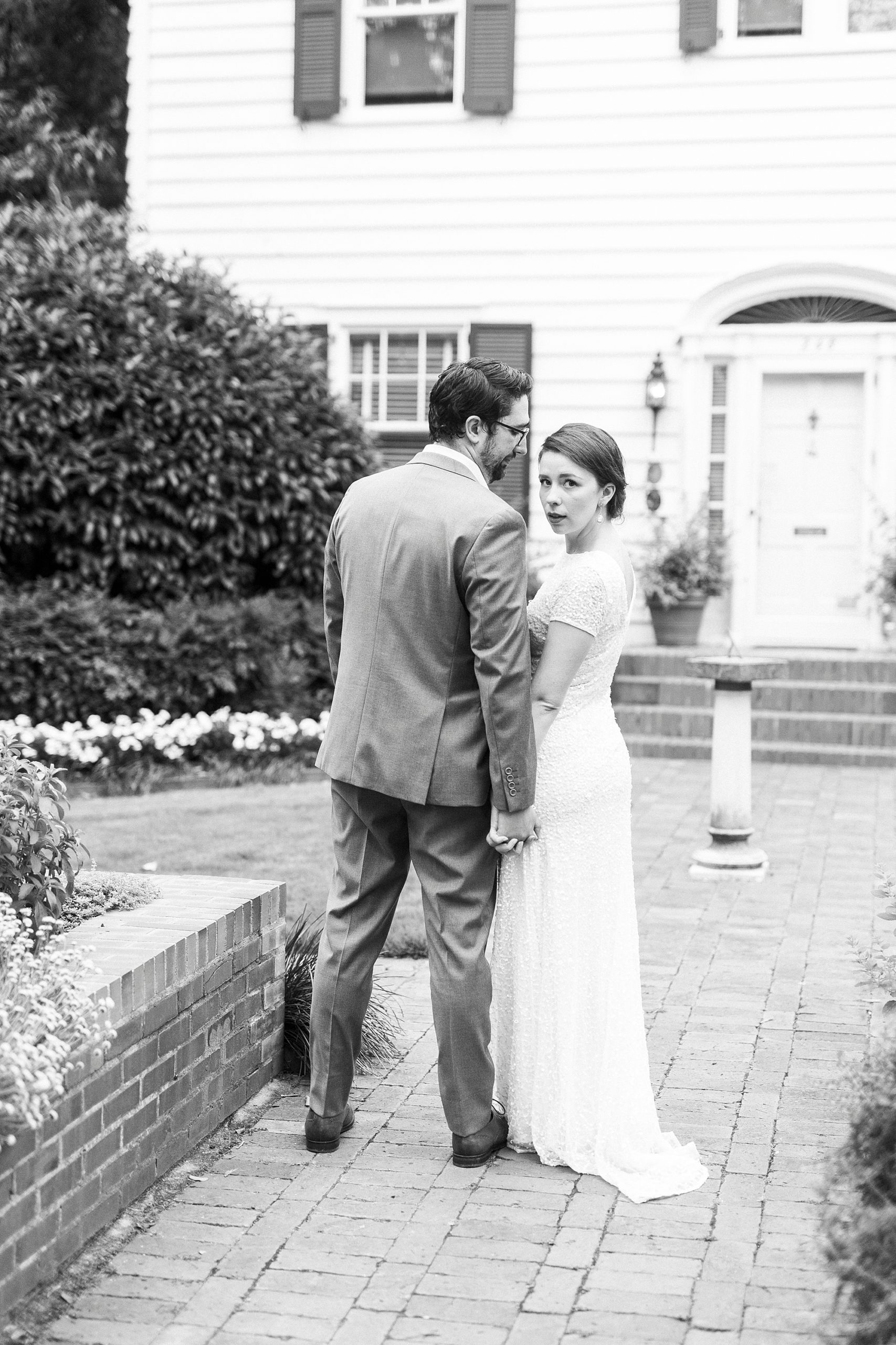 woman looks back over shoulder at husband at Wing Haven Garden