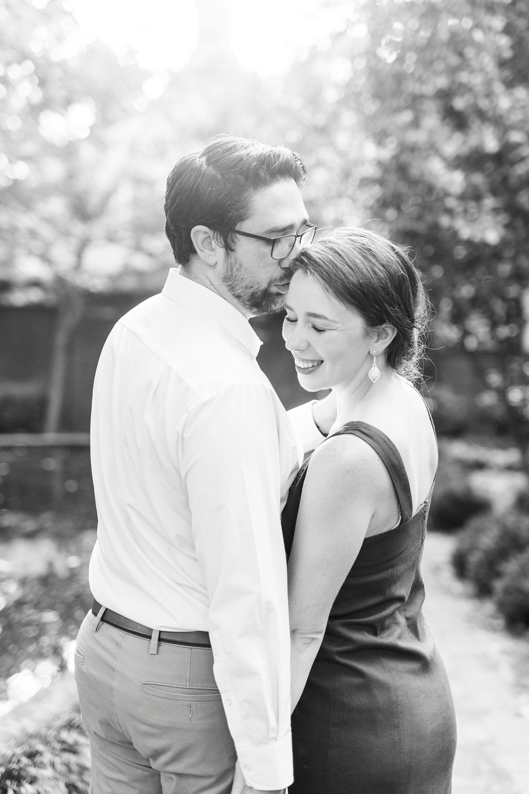 man kisses wife during Wing Haven Garden anniversary session 