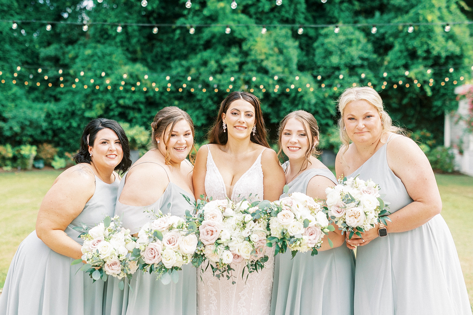 bride and bridesmaids hug together at Separk Mansion