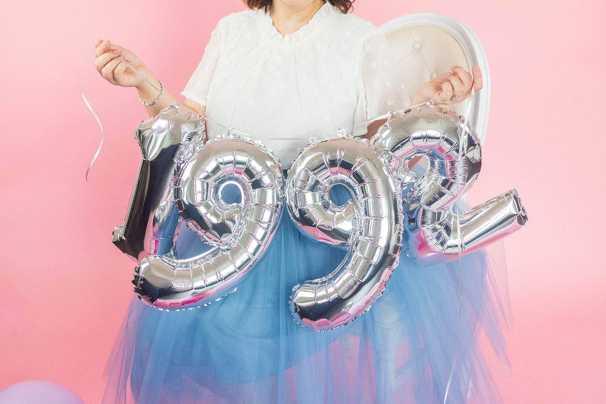 birthday girl holds 1992 balloons for 30th birthday photos