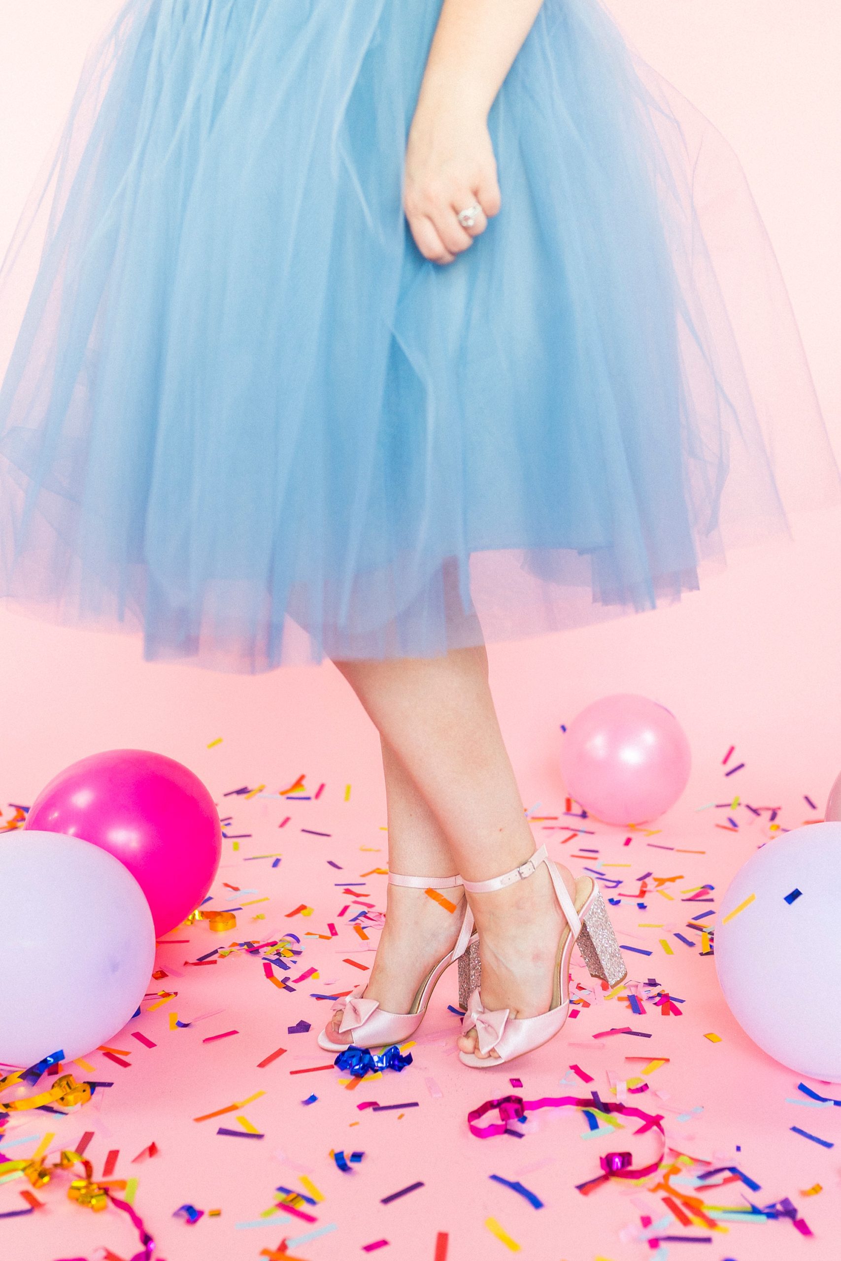 textured blue skirt of woman standing on confetti at 30th birthday portraits