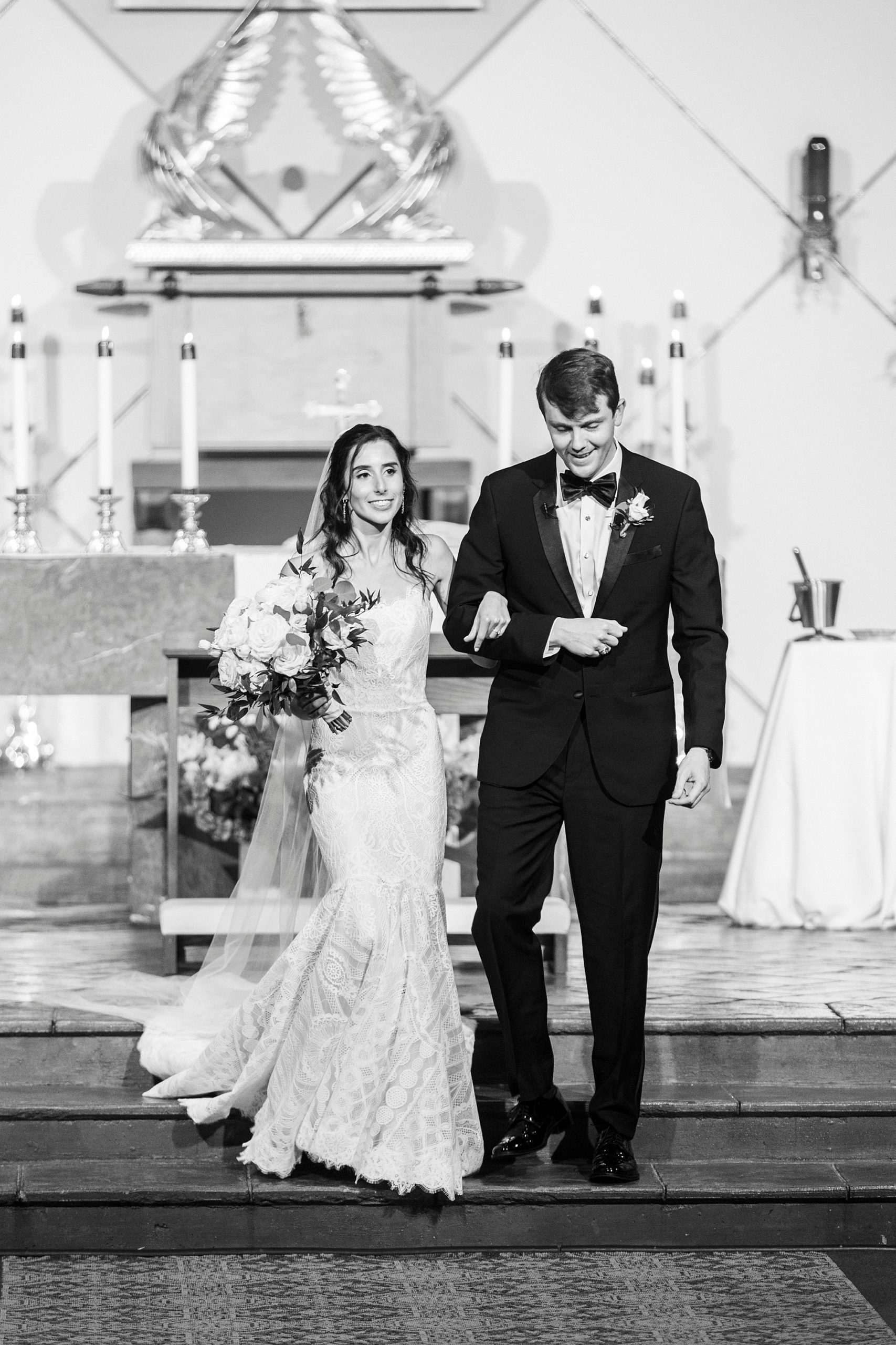 bride and groom leave traditional church wedding at St. Gabriel Catholic Church