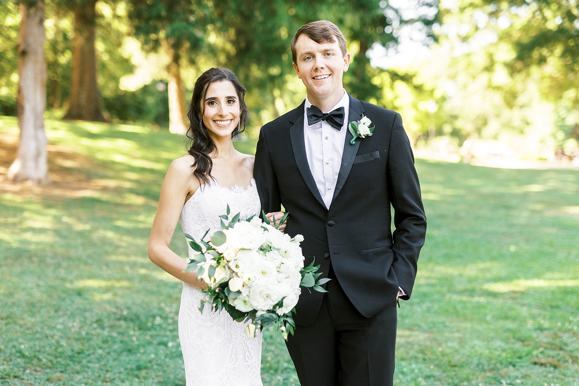 newlyweds stand together in Freedom Park