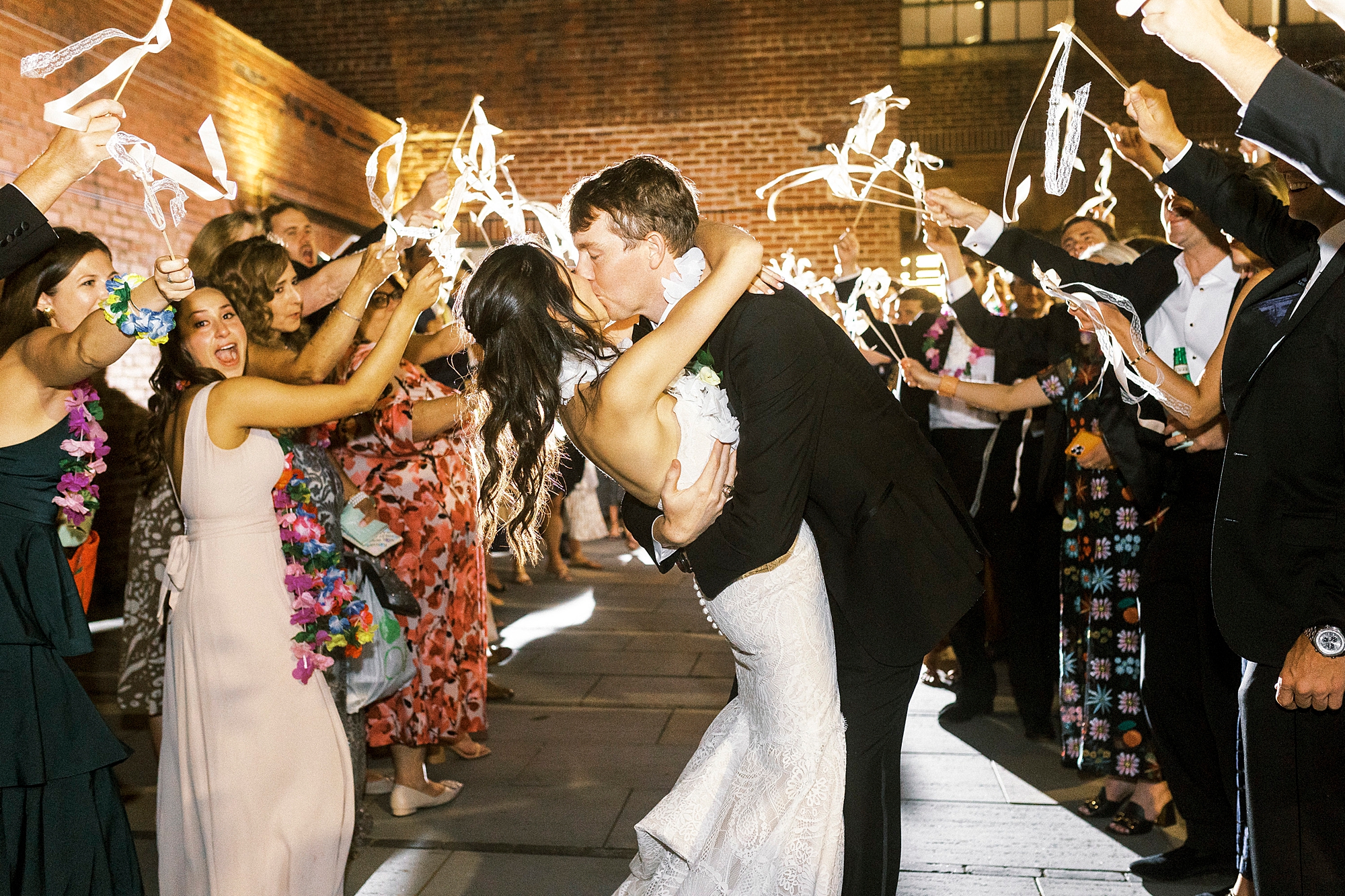 newlyweds kiss during sparkler exit at Byron's South End