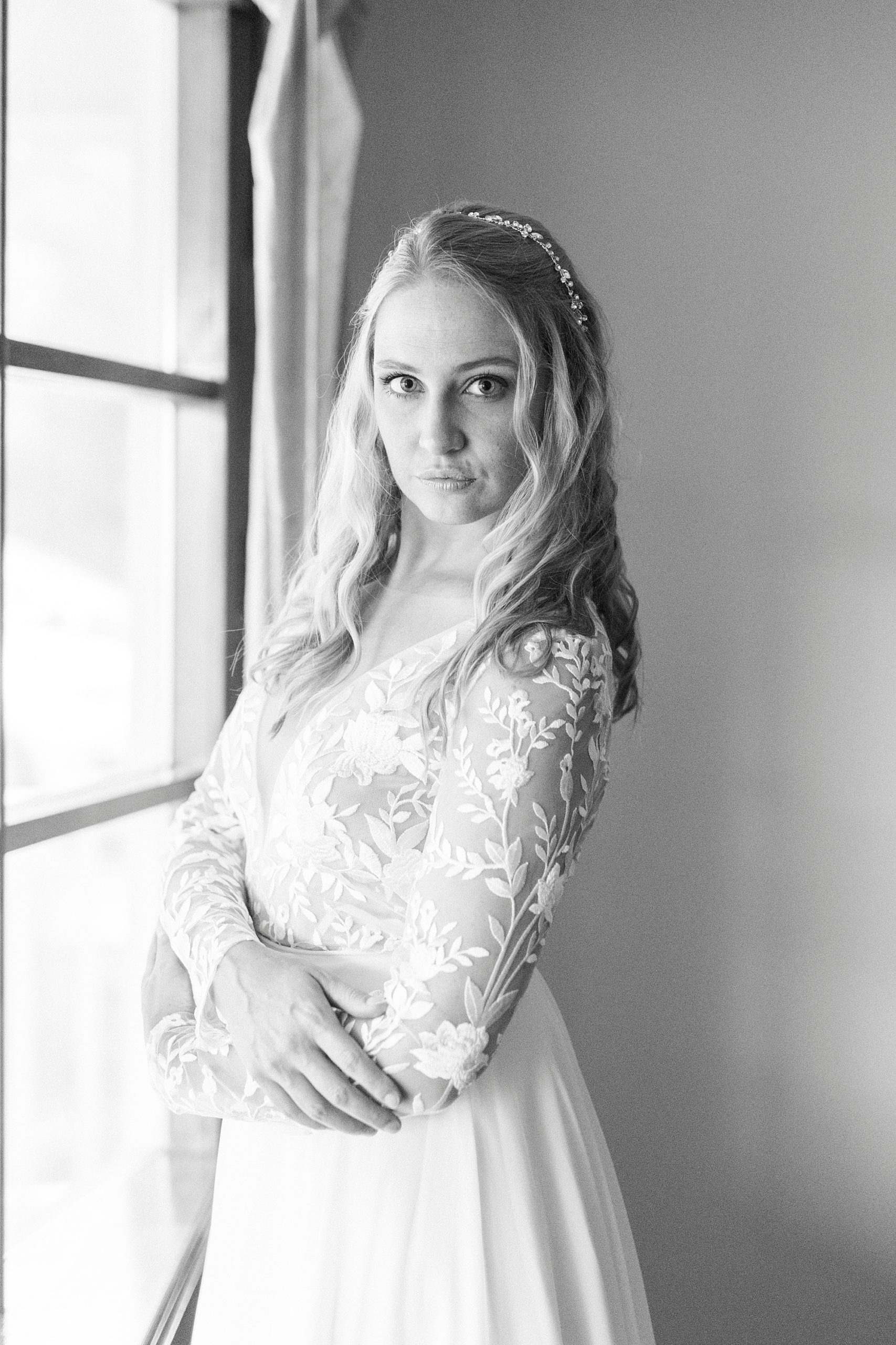bride looks over shoulder during bridal portraits at home in Lenoir NC