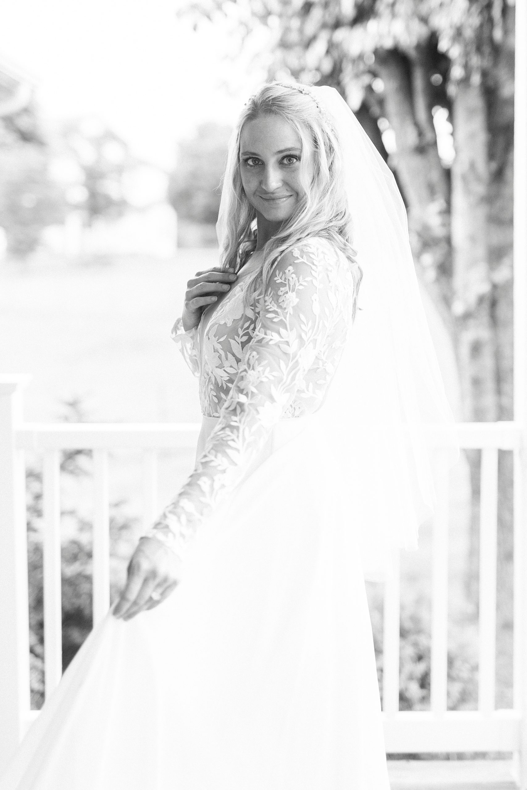 bride looks over shoulder turning with gown's skirt